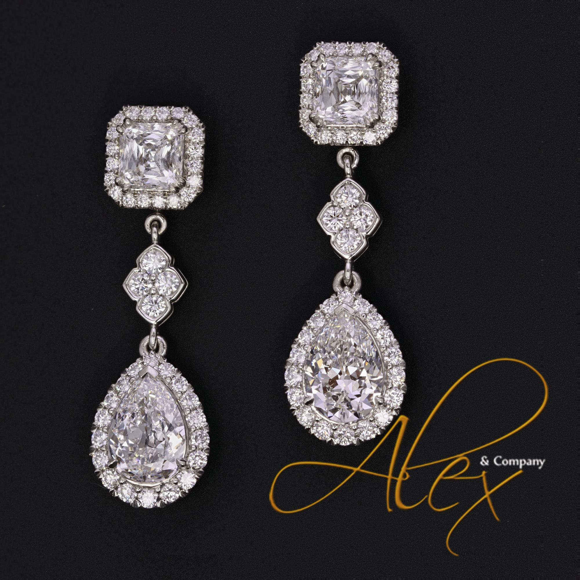 From the exclusive collection at Alex & Co. These breath taking bespoke earrings are a blend of art and design. The top features two prong set asscher cut diamonds totaling 2.10ctw., E-F color, VS2 clarity. The diamonds are surrounded by a halo of