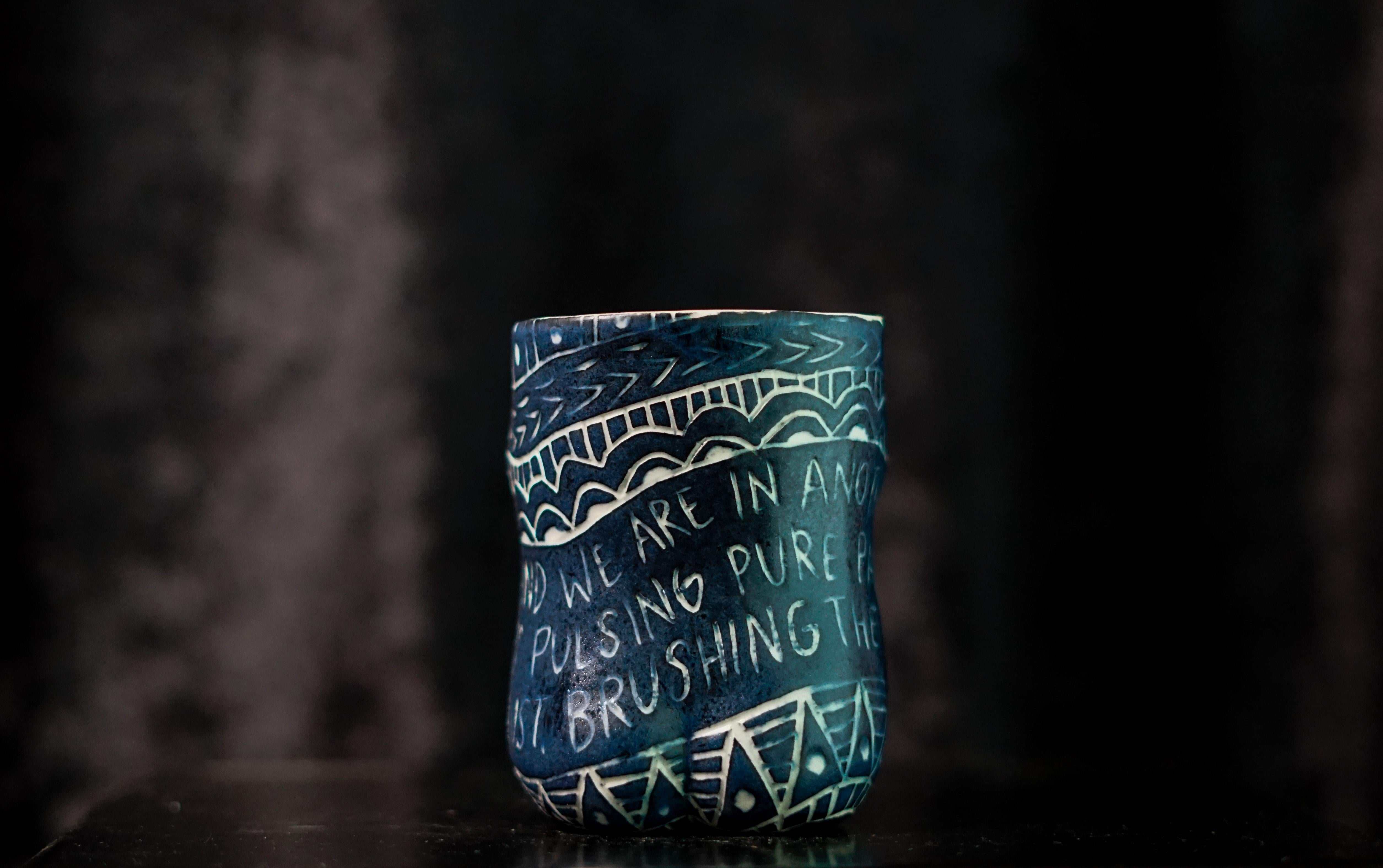 “And You Blink..”, 2019
From the series Fragments of Our Love Story
Porcelain cup with sgraffito detailing
4 x 3 x 3 inches.

“And you blink..” And you blink and we are in another moment. Fingertips pulsing pure passion into placating lust. Brushing