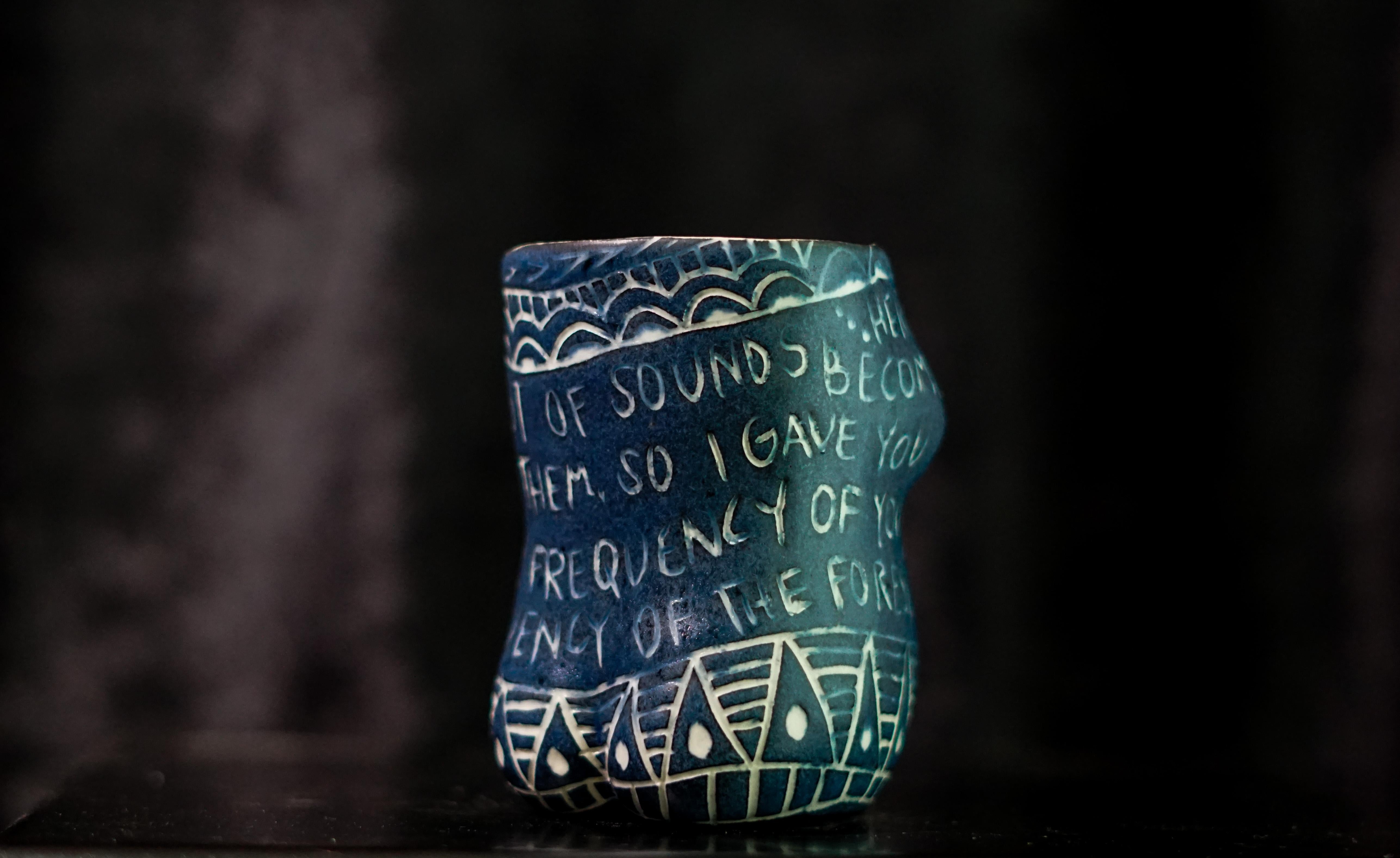 “Here I Learn..”, 2019
From the series Fragments of Our Love Story
Porcelain cup with sgraffito detailing
4 x 3 x 3 inches.

“Here I learn..” Here I learn the smallest of sounds become thunder if you let them. So I gave you silence to hear every