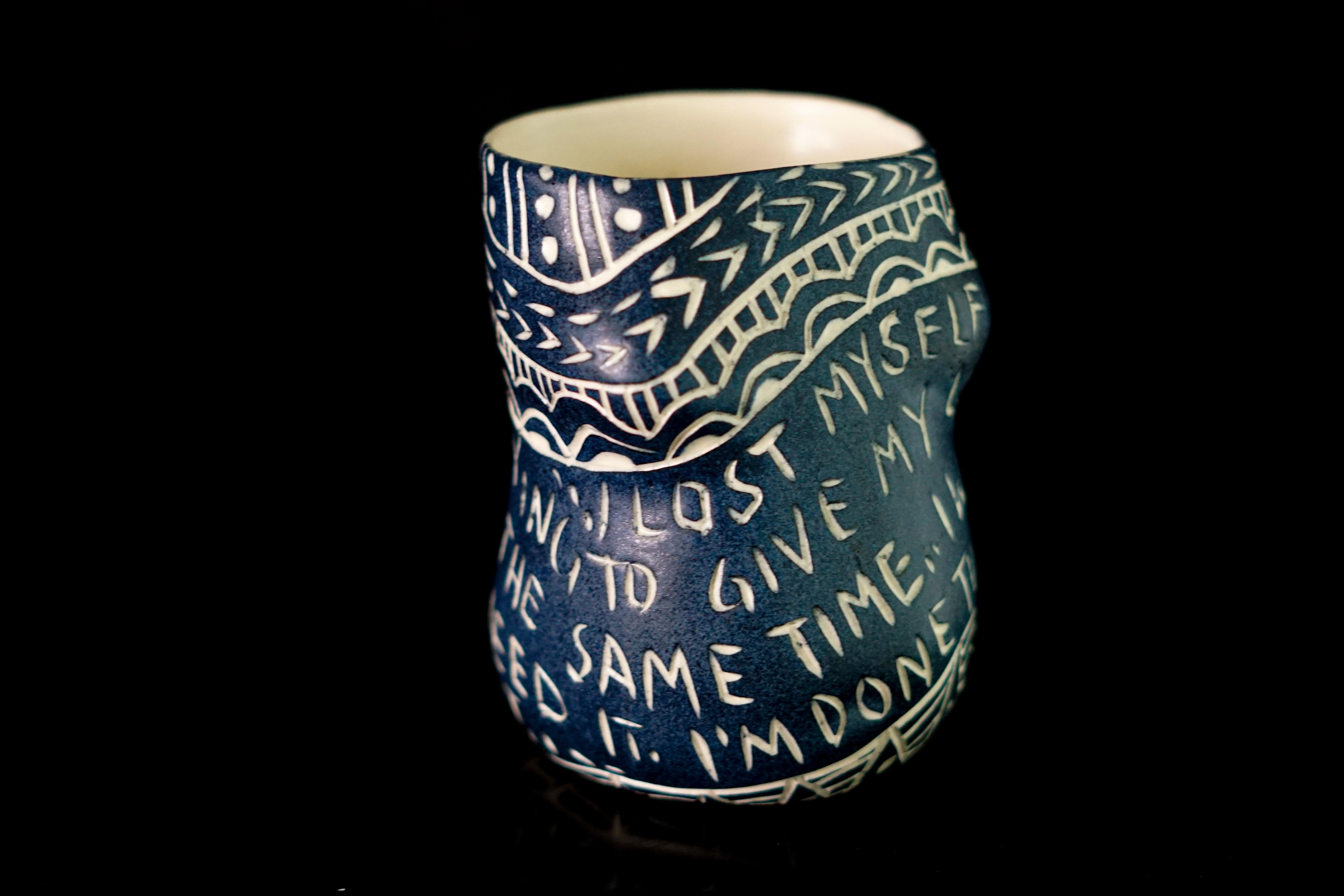 I lost myself., 2019 by Alex Hodge
From the series Fragments of Our Love Story
Porcelain cup with sgraffito detailing
4 in. x 3 in. W x 2.75 in.

This cup is one of 48 that make up the installation, “Fragments of Our Love Story.” These cups feature