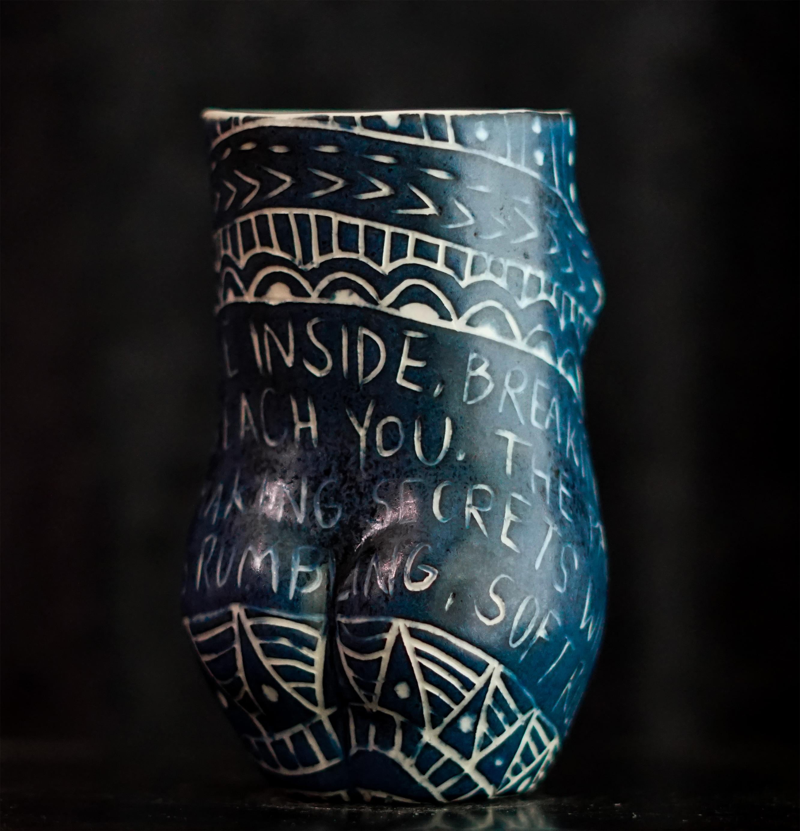 “...Is Beating Me From the Inside...” 2019
From the series Fragments of Our Love Story
Porcelain cup with sgraffito detailing
5 x 3 x 3 inches.

“Is beating me from the inside..” …Is beating me from the inside. Breaking my ribcage just to
reach you.