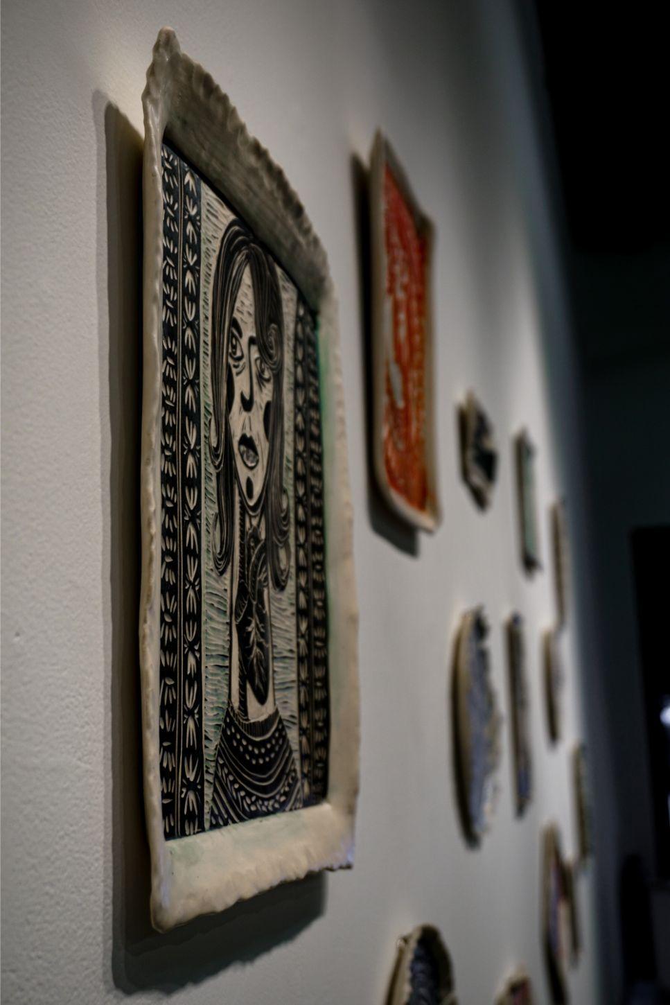 The portraits, loaded with symbolic imagery, gaze out at the viewer, with a variety of intensities and emotions. This is to say, each woman has a story, which may not be directly evident; however, through the use of iconic imagery and expression,
