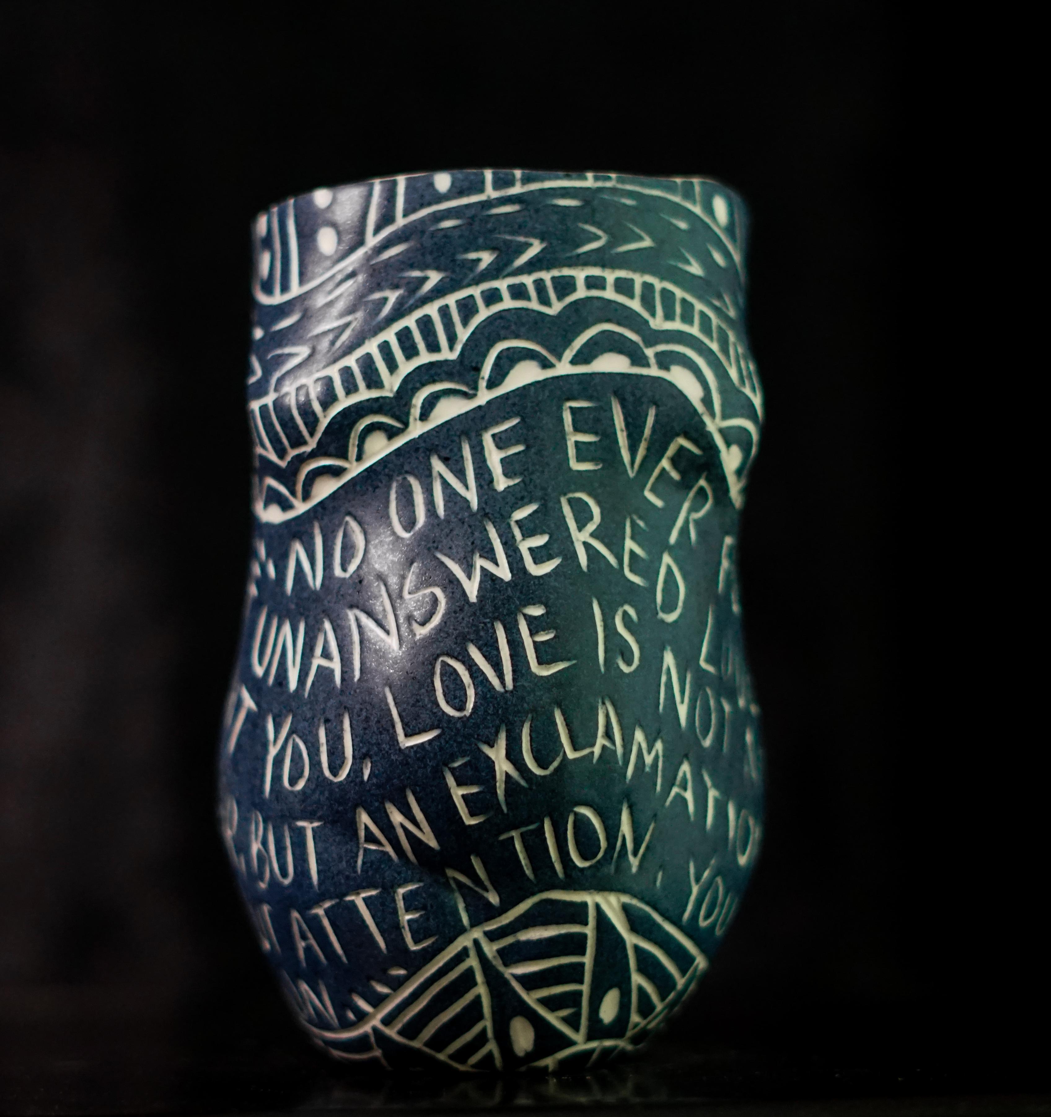 “No One Ever Fed You...” Porcelain cup with sgraffito detailing by the artist