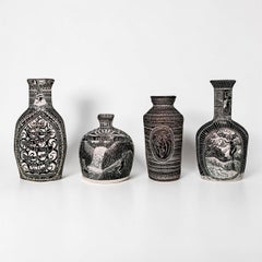 Set di quattro vasi di porcellana intagliata