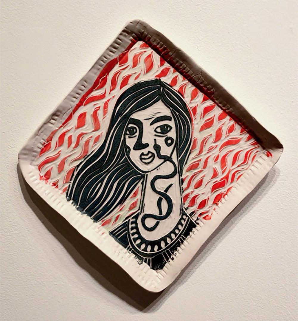 The portraits, loaded with symbolic imagery, gaze out at the viewer, with a variety of intensities and emotions. This is to say, each woman has a story, which may not be directly evident; however, through the use of iconic imagery and expression,