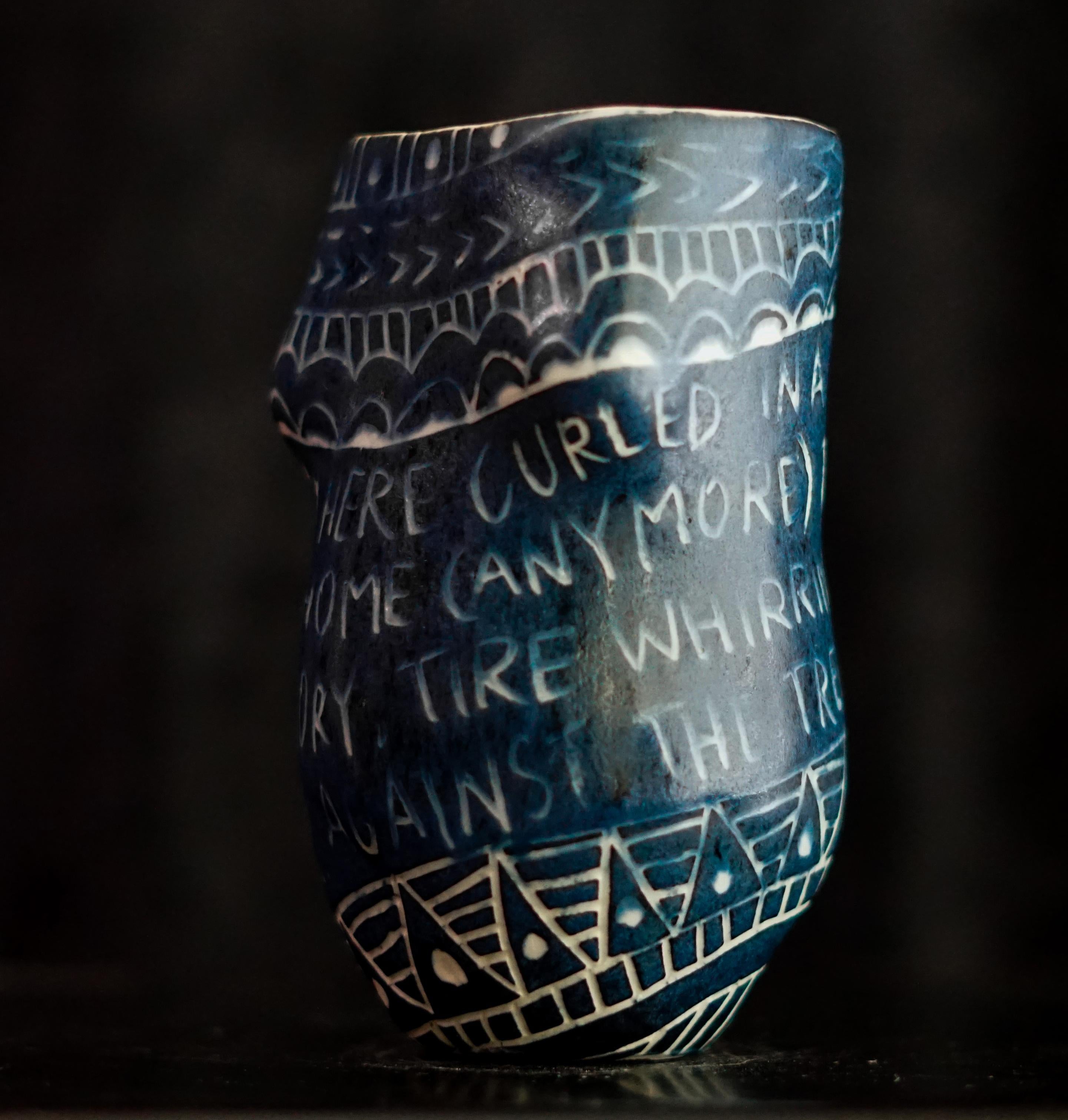 “So I Lay Here...” 2019
From the series Fragments of Our Love Story
Porcelain cup with sgraffito detailing
5 x 3 x 3 inches.

“So I lay here..” So I lay here curled in a home that is not my home (anymore). The sound of the
memory. Tire whirring on