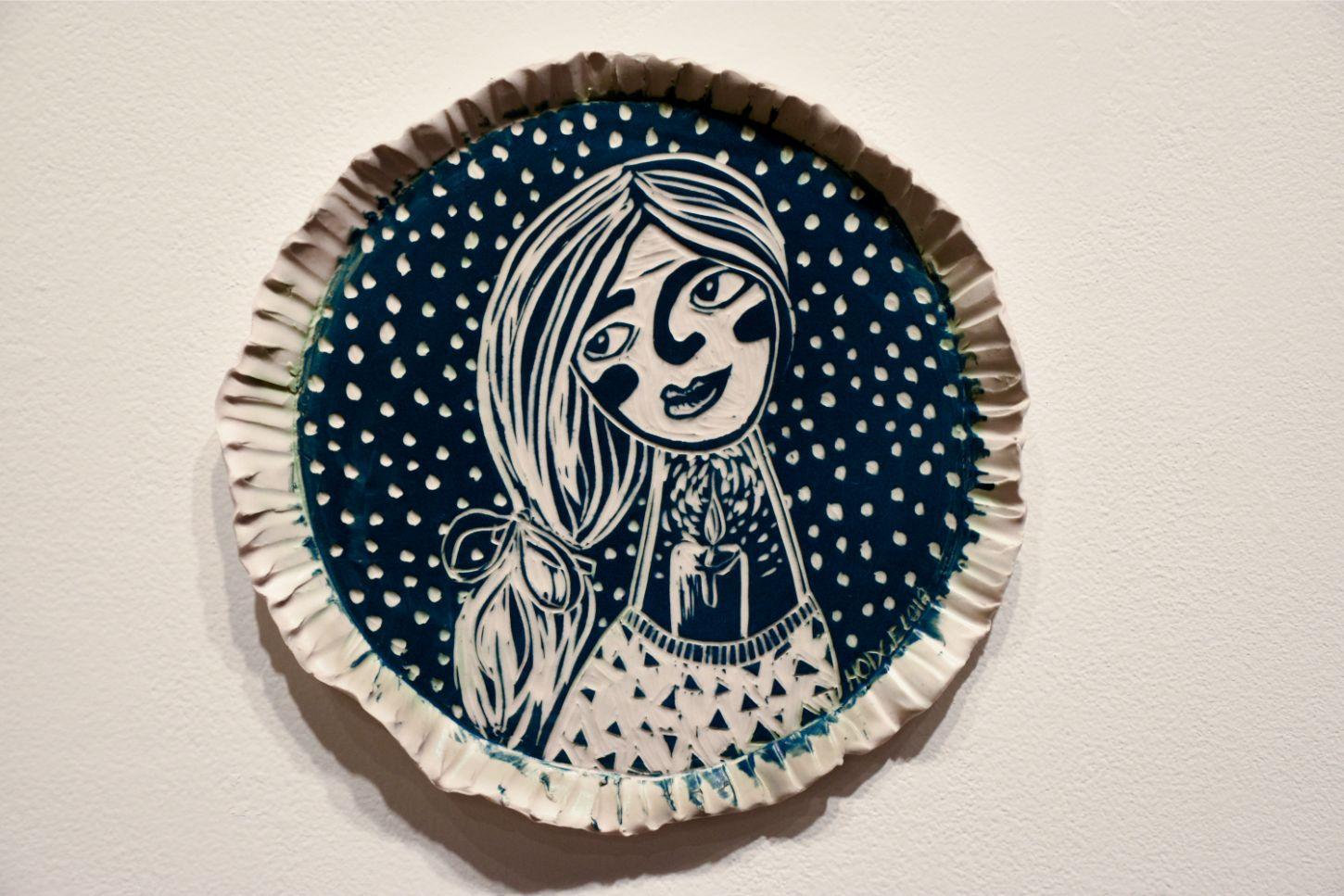 The portraits, loaded with symbolic imagery, gaze out at the viewer, with a variety of intensities and emotions. This is to say, each woman has a story, which may not be directly evident; however, through the use of iconic imagery and expression,