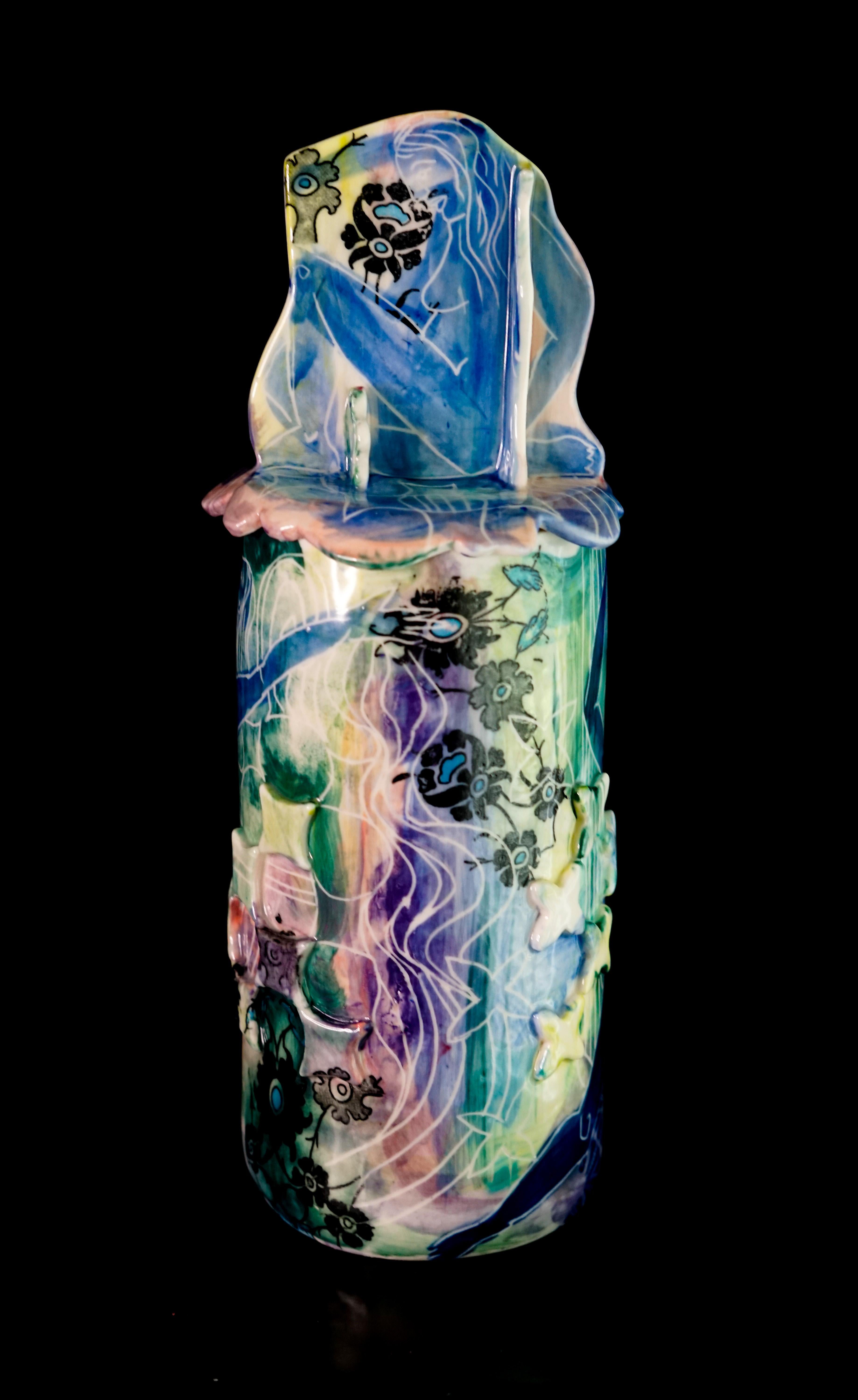 The Moon, 2022 by Alex Hodge
Porcelain Jar with Sgraffito, Transfers, and underglaze Detailing
10.5 in x 4 in x 4 in

This sculptural jar is the first to feature the figure in combination with a collaged and carved surface. The women dance around in