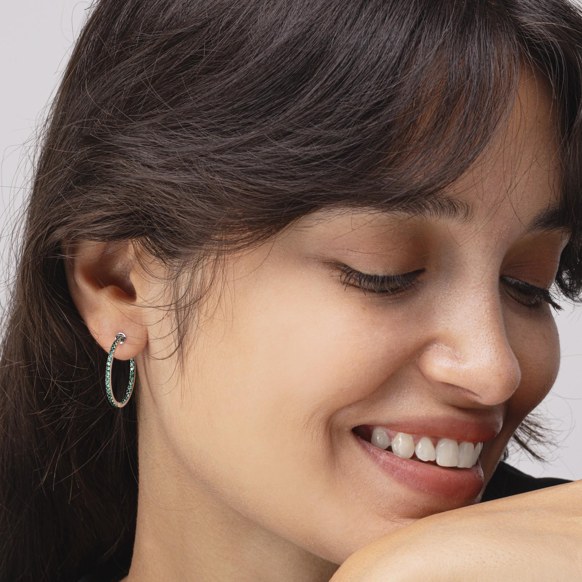 Alex Jona design collection, hand crafted in Italy, 18 karat white gold hoop earrings featuring 0.72 carats of emeralds.

Alex Jona jewels stand out, not only for their special design and for the excellent quality of the gemstones, but also for the