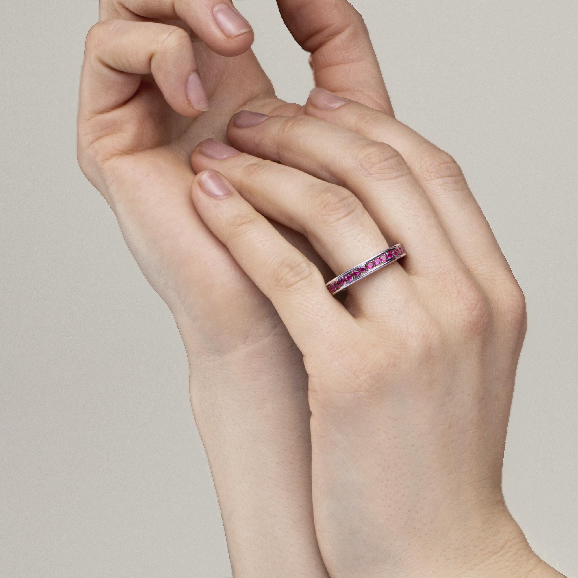 Alex Jona design collection, hand crafted in Italy, 18 karat white gold eternity band ring set with 1.44 carats of round cut rubies.  US size 6.5.    
Alex Jona jewels stand out, not only for their special design and for the excellent quality of the