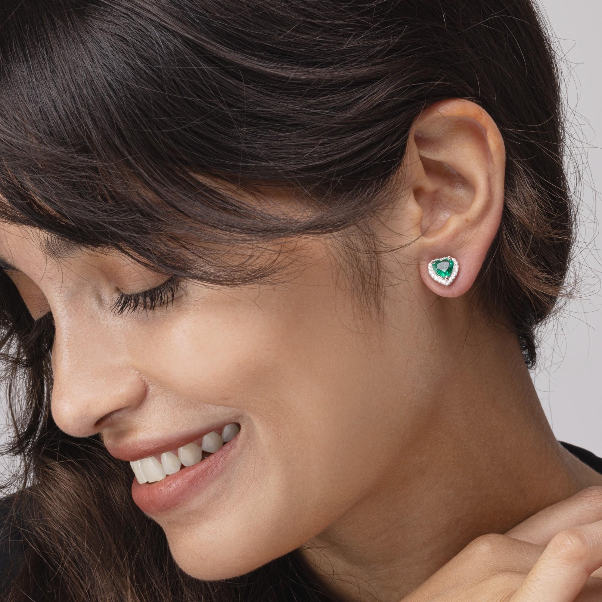 Alex Jona design collection, hand crafted in Italy, 18 karat white gold stud earrings set with 1.96 carats of heart cut emeralds and 0.35 carats of white diamonds.

Alex Jona jewels stand out, not only for their special design and for the excellent
