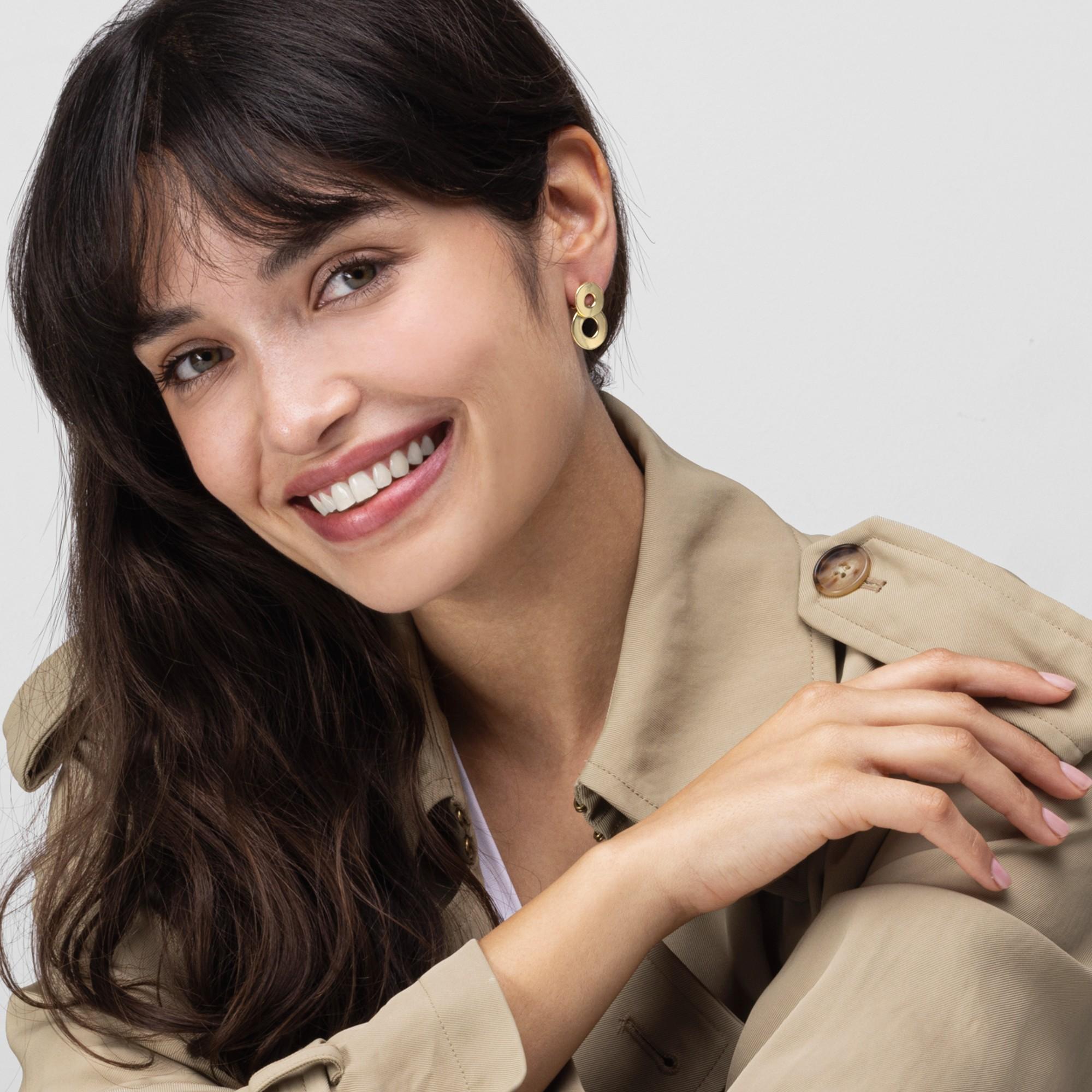 Alex Jona design collection, hand crafted in Italy, 18 karat yellow gold clip-on pendant earrings consisting of two partially overlapping pierced disks.

Alex Jona jewels stand out, not only for their special design and for the excellent quality of