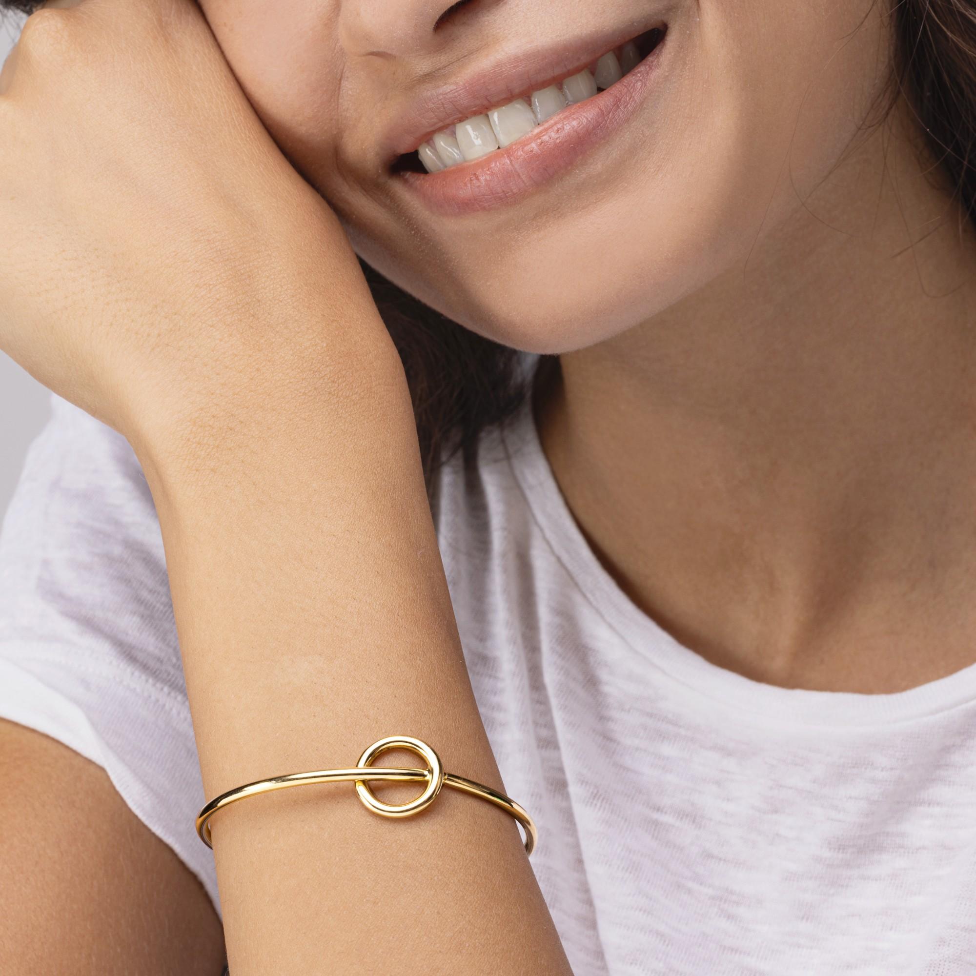 Alex Jona design collection, hand crafted in Italy, 18 karat yellow gold bracelet featuring a central crossing circle element.
Dimensions:
2.14 in. H x 2.43 in. W x 0.62 in. D
55 mm. H x 62 mm. W x 16 mm. D
Alex Jona jewels stand out, not only for