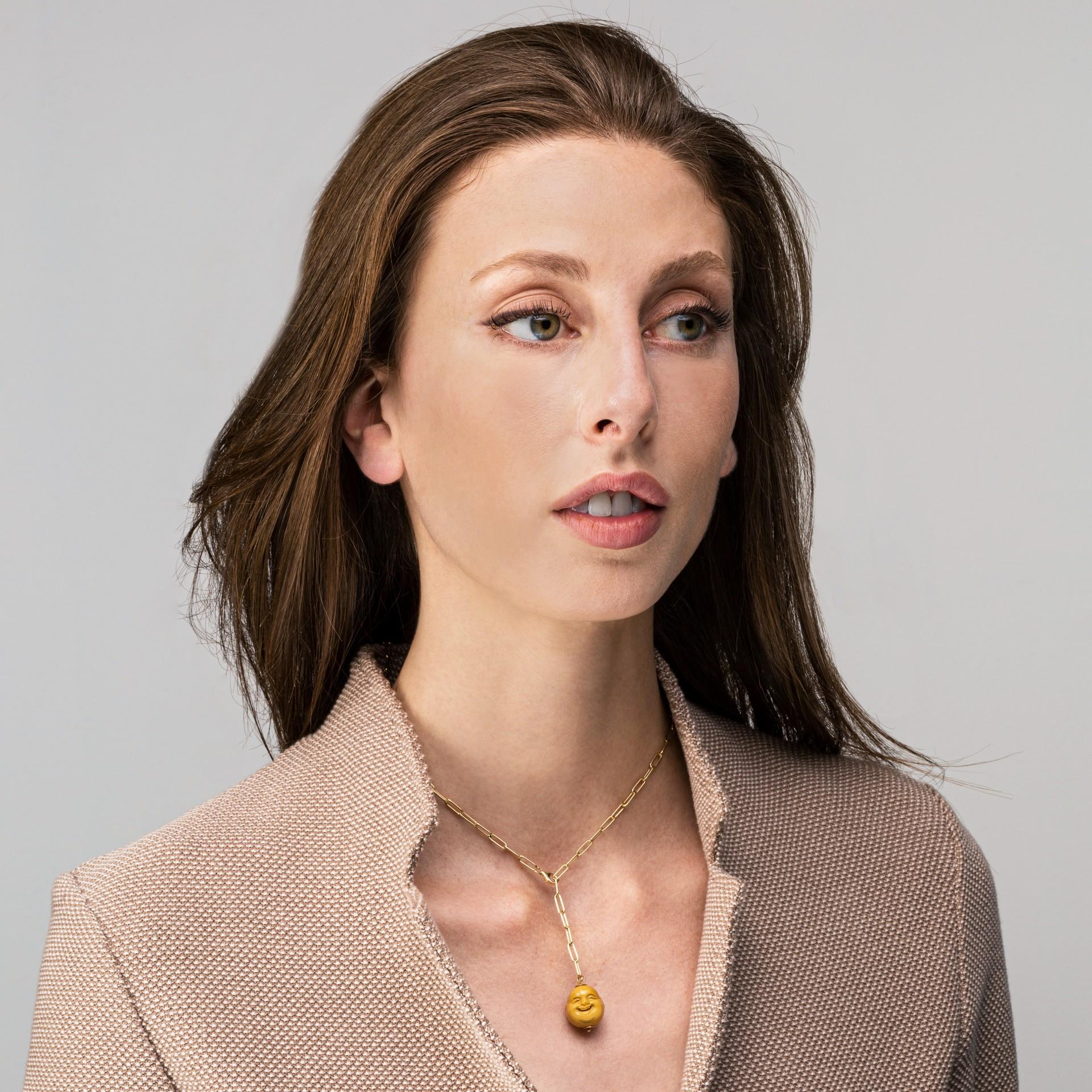 Alex Jona design collection, hand crafted in Italy, 18 karat yellow gold necklace suspending a jasper smile face charm.

Alex Jona gifts stand out, not only for their special design and for the excellent quality, but also for the careful attention
