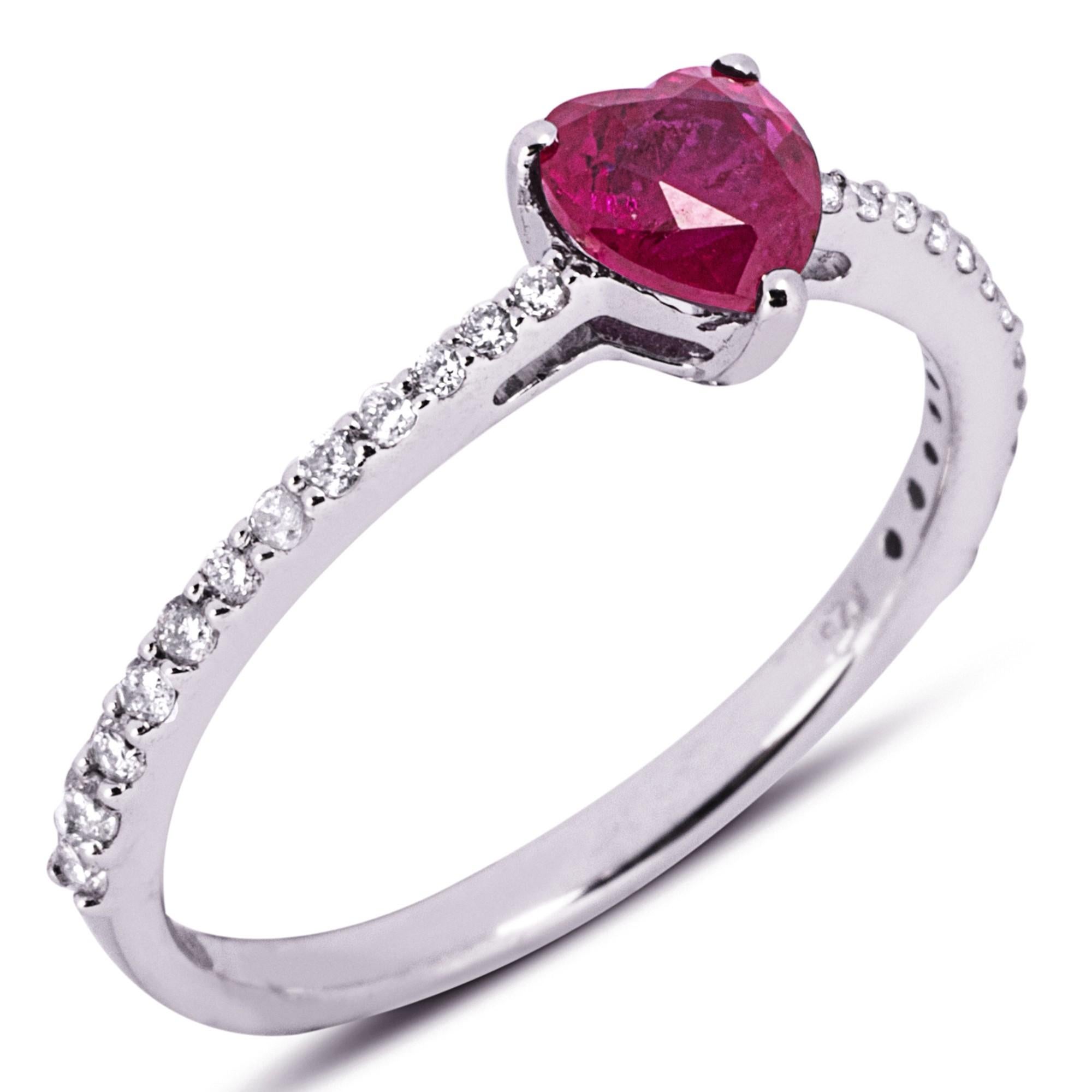 Alex Jona Design collection, hand crafted in Italy, 18 Karat white gold ring centering a 0.99 carat heart cut natural ruby, accented with 24 white diamonds, F-G color, VS clarity, for total 0.24 carats.
Alex Jona jewels stand out, not only for their