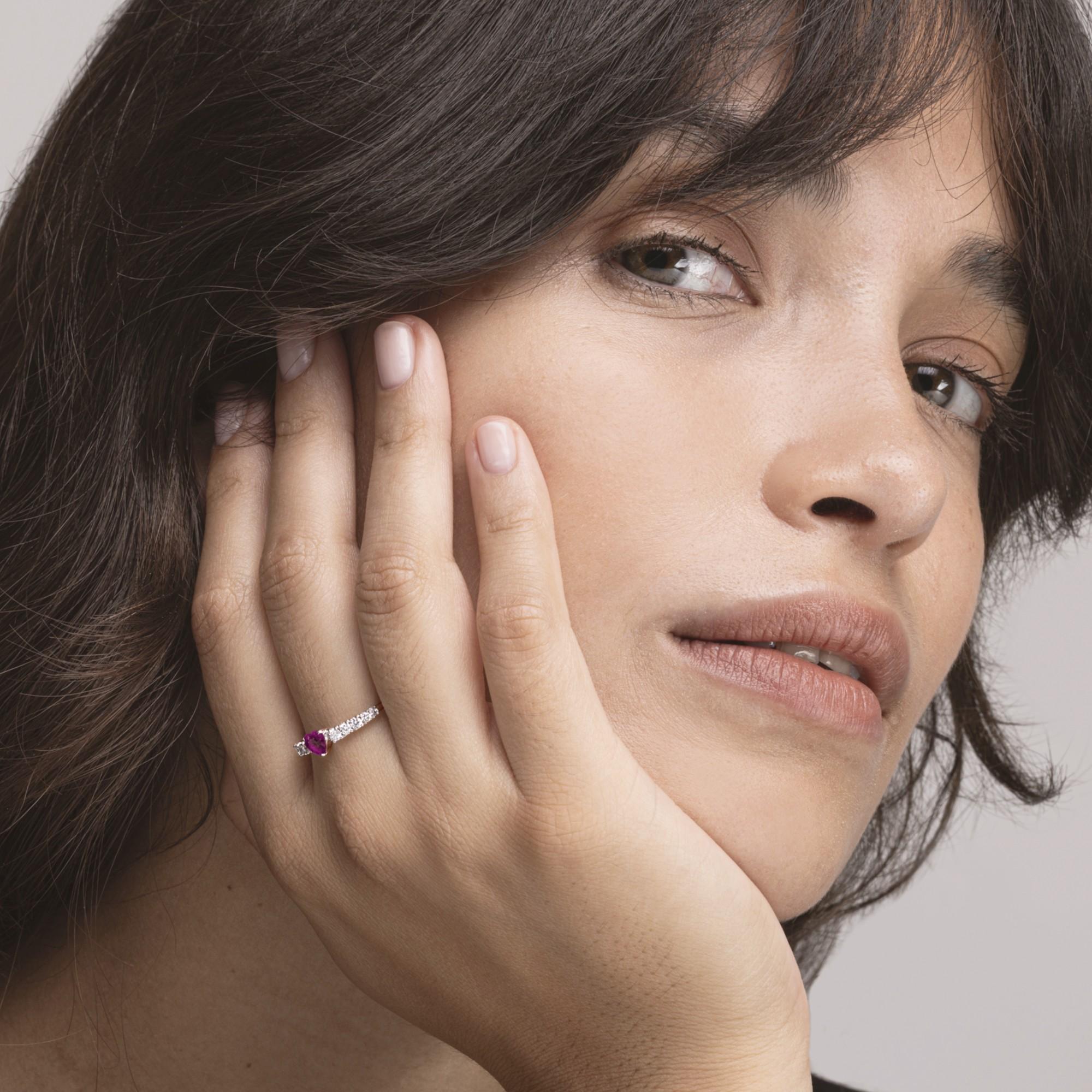 Alex Jona Design collection, hand crafted in Italy, 18 Karat white gold ring centering a 0.60 carat heart cut natural ruby, accented with 0.32 carats of white diamonds, F-G color, VS clarity.
Alex Jona jewels stand out, not only for their special