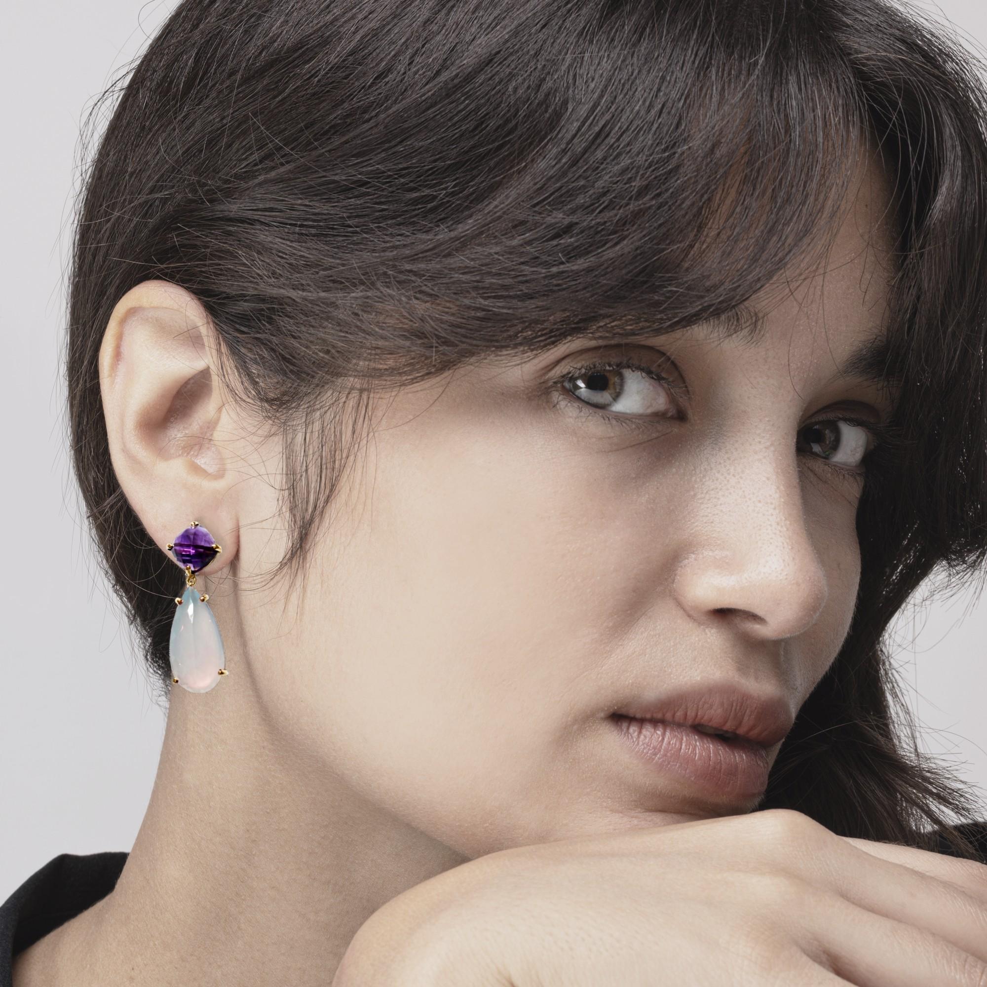 Alex Jona design collection, hand crafted in Italy, earrings with faceted amethyst cushions and two faceted drops of chalcedony for total carats 29.75.

Alex Jona jewels stand out, not only for their special design and for the excellent quality of