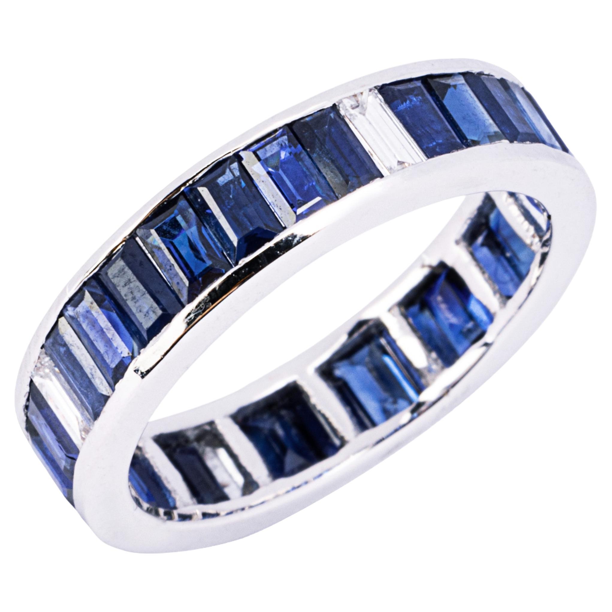 Alex Jona design collection, handmade in Italy, eternity ring in 18k white gold, with 28 baguette-cut blue sapphires weighing 3.84 carats alternating with a baguette cut white diamond, total carats of 0.26.

Alex Jona gifts stand out, not only for