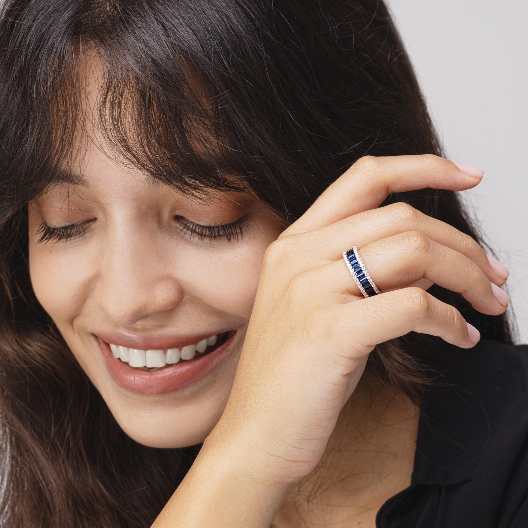 Alex Jona design collection, hand crafted in Italy, 18 karat white gold eternity ring, featuring baguette cut blue sapphires weighing 2.84 carats and two rows of round cut white diamond for total carats 0.24.

Alex Jona gifts stand out, not only for