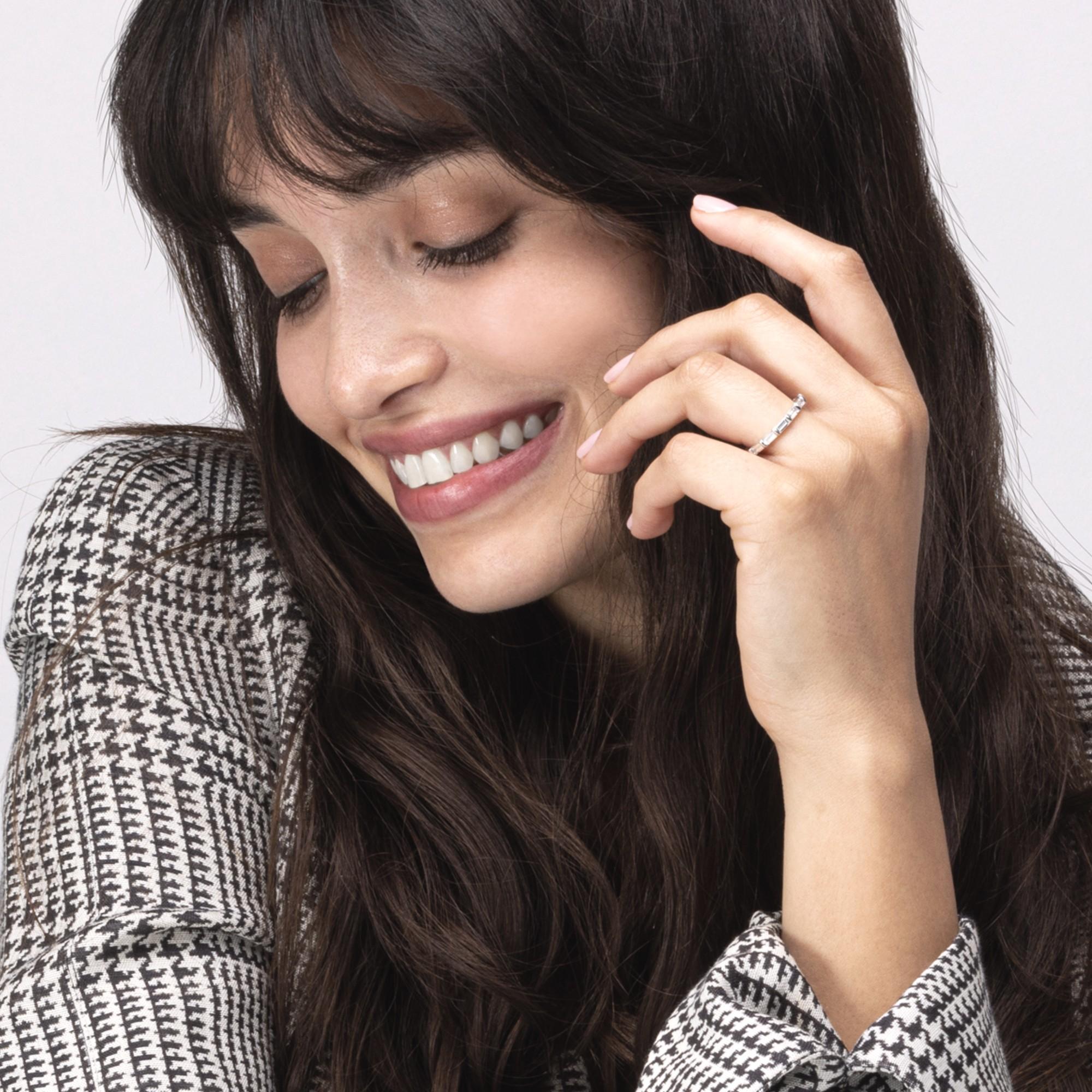 Alex Jona design collection, hand crafted in Italy, Platinum eternity band ring, showcasing baguette cut white diamonds, bezel-set, weighing 1.46 total carats, F color, VVS clarity.
Alex Jona jewels stand out, not only for their special design and