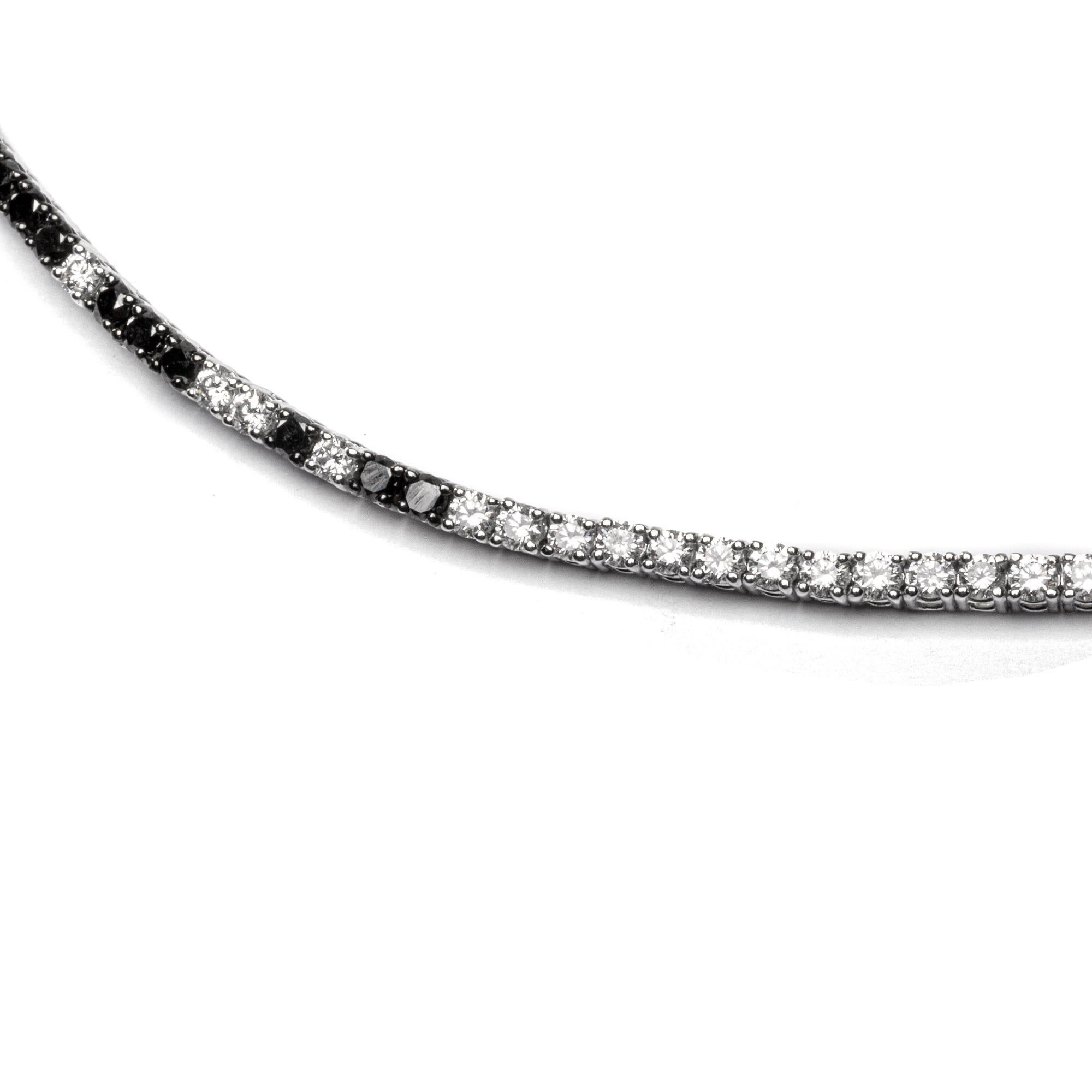 Alex Jona design collection, hand crafted in Italy, 18 karats white gold tennis bracelet, 7 in. long, set with 47 white diamonds weighing 1.70 carats in total, alternating with 29 black diamonds weighing 1.00 carat in total.
Alex Jona jewels stand