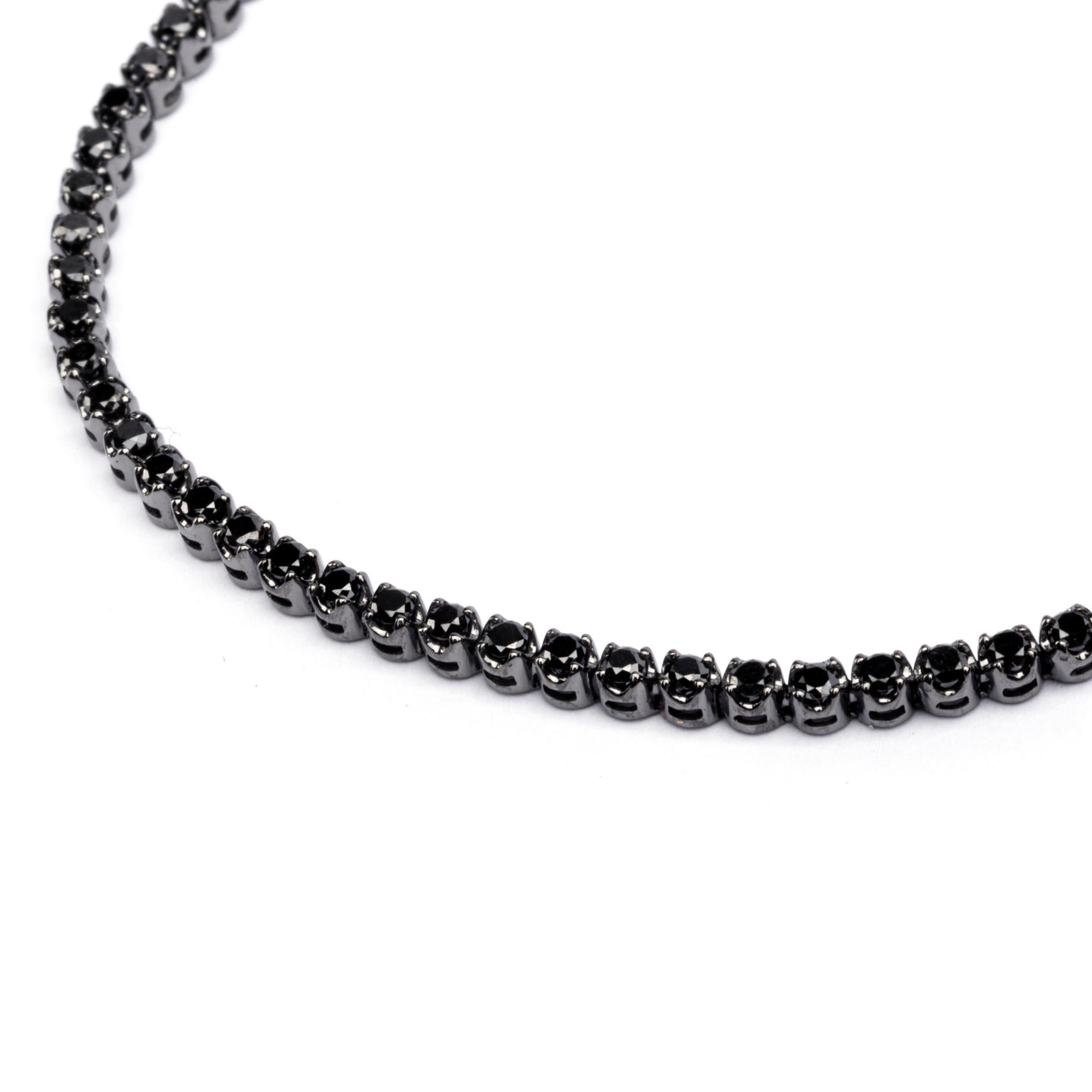 Alex Jona design collection, hand crafted in Italy, 18 karat black rhodium white gold tennis bracelet, 7.48 in/19 cm long, set with 70 black diamonds weighing 3.22 carats in total. Dimensions: 7.48 in. L / 0.09 in. D/ 0.13 in. H - 190 mm L / 2.50 mm