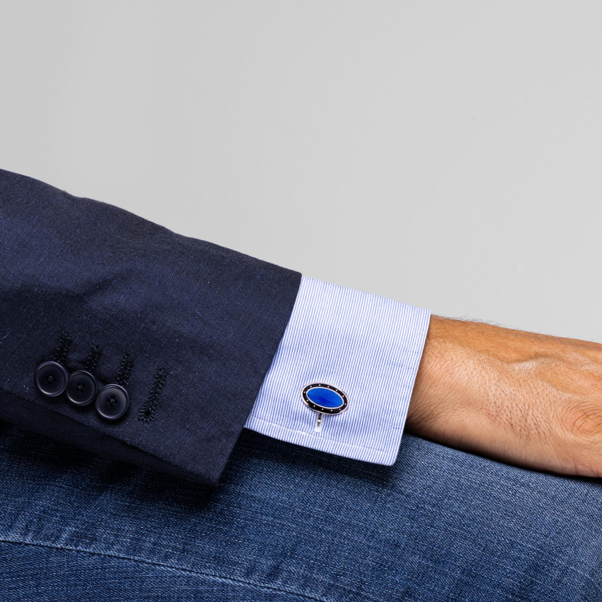 Alex Jona design collection, hand crafted in Italy, rhodium plated oval sterling silver cufflinks with blu and black enamel. These cufflinks feature a T-Bar fastening, aiding in easy use and confidence that they'll stay secured to your shirt. Marked