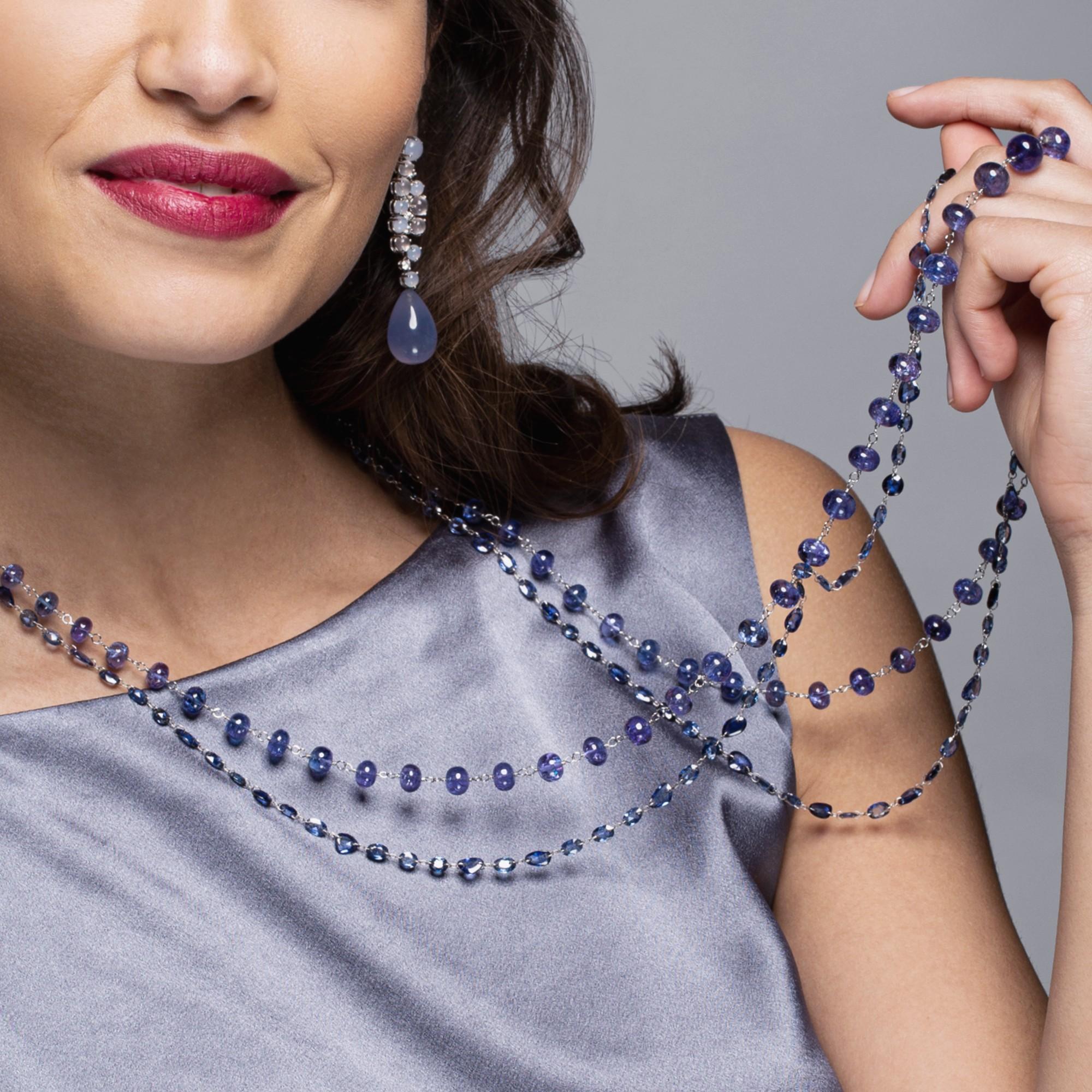 Alex Jona design collection, hand crafted in Italy, 39.37 inch -100 cm long necklace, featuring 64.44 carats of  flat cut blue sapphires, drilled and linked in 18 Karat white gold.
Alex Jona jewels stand out, not only for their special design and