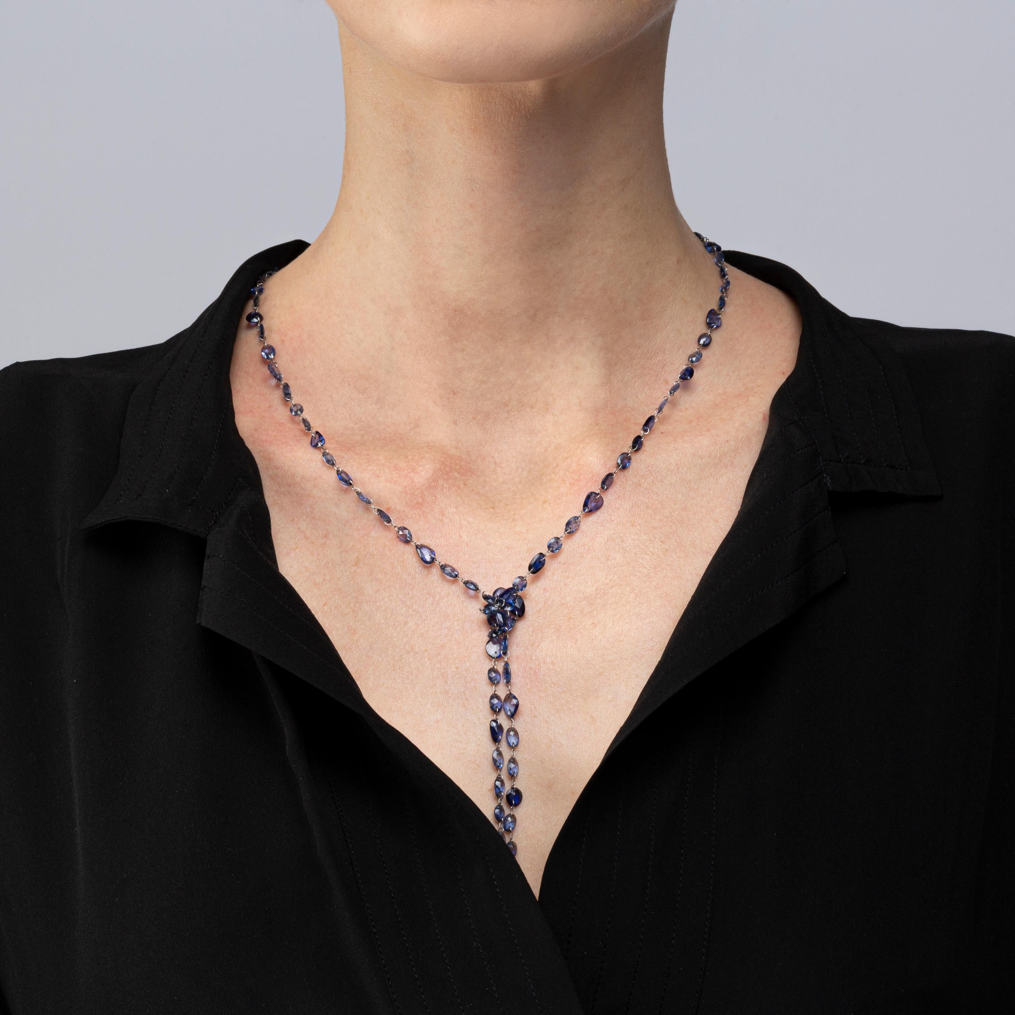 Alex Jona design collection, hand crafted in Italy, long necklace, 39.37 inch long -100 cm, featuring 64.44 carats of  flat cut blue sapphires, drilled and linked in 18 Karat white gold.

Alex Jona jewels stand out, not only for their special design