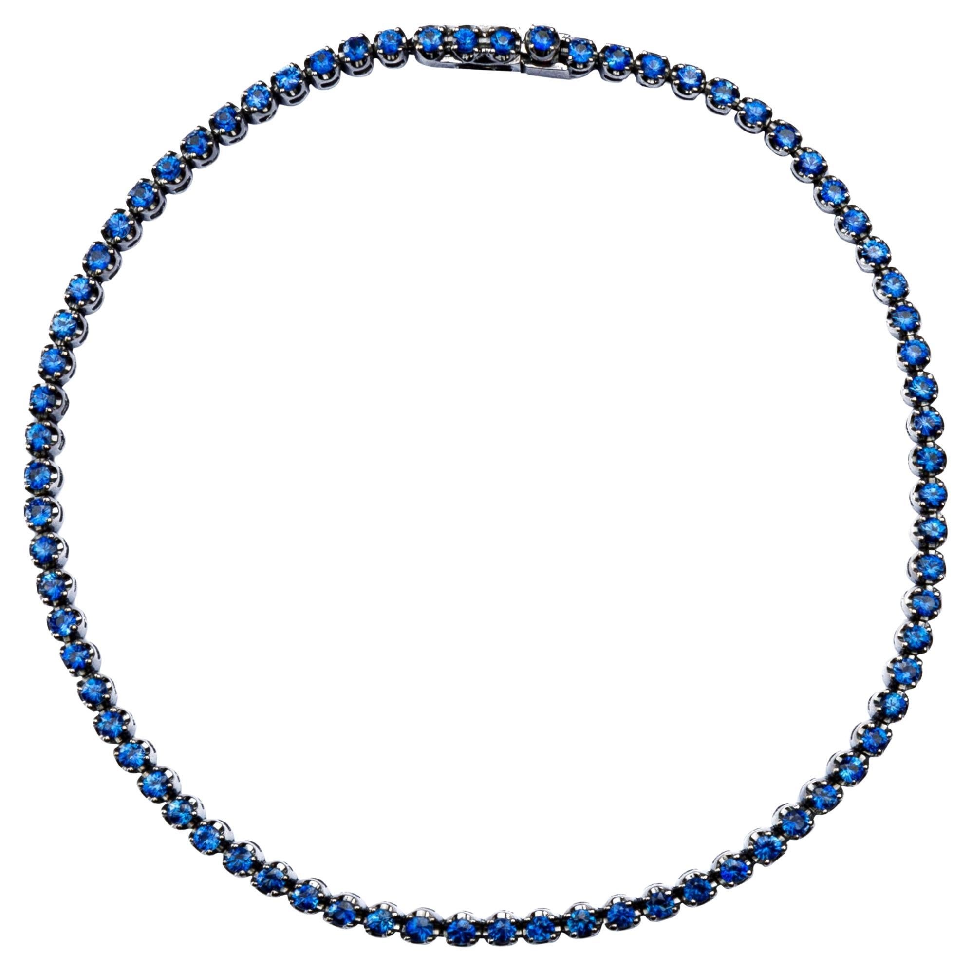 Bracelet tennis Alex Jona en or blanc 18 carats et saphirs bleus