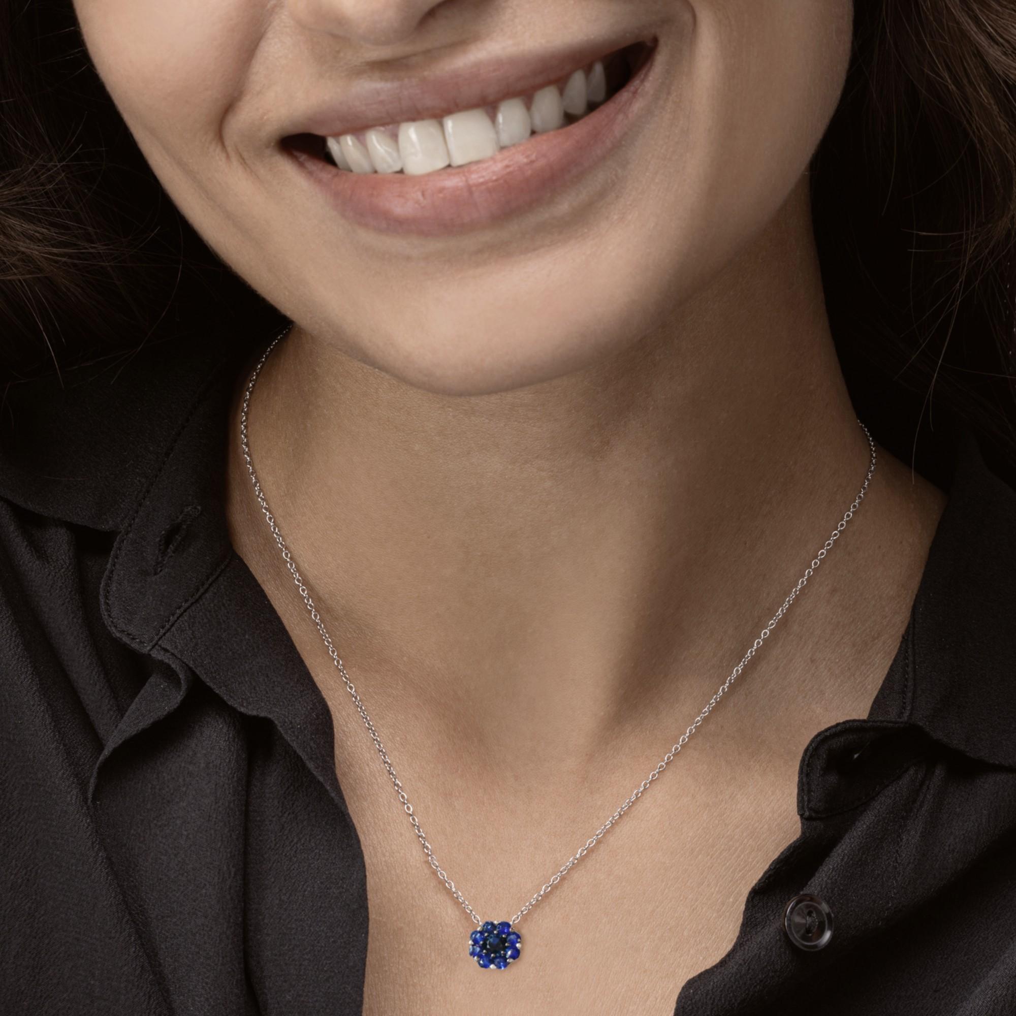 Alex Jona design collection, hand crafted in Italy, blue sapphire 0.90 carat, shape flower in 18 karat white gold pendant necklace.

Alex Jona jewels stand out, not only for their special design and for the excellent quality of the gemstones, but