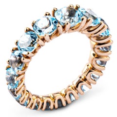 Alex Jona, bague à anneau d'éternité en or rose 18 carats avec topaze bleue