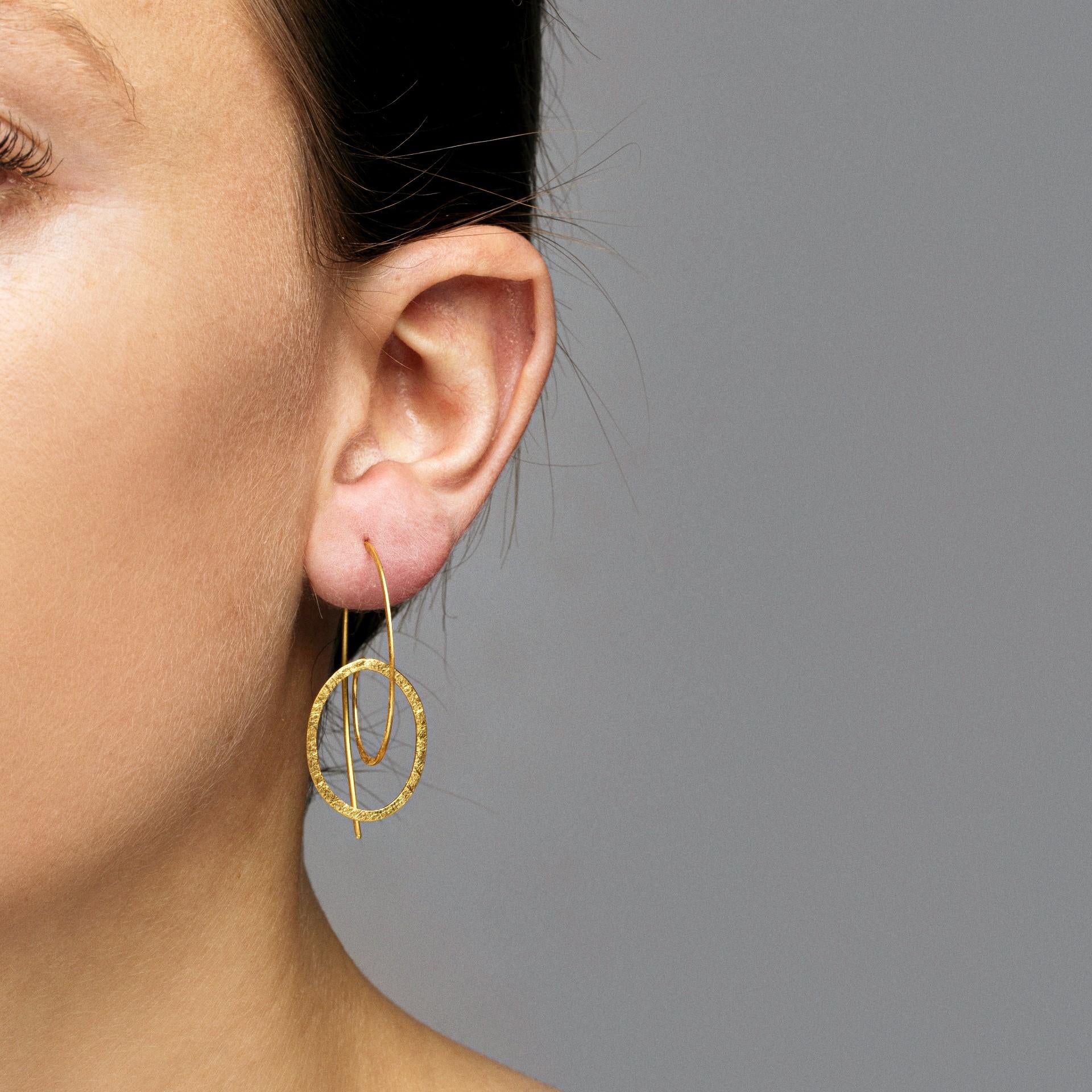 Alex Jona design collection, hand crafted in Italy, 18 karat rough frosted yellow gold circle pendant earrings.
Dimensions: H 1.15in/28mm, W 0.6in/15mm, D 1in/26mm.

Alex Jona jewels stand out, not only for their special design and for the excellent