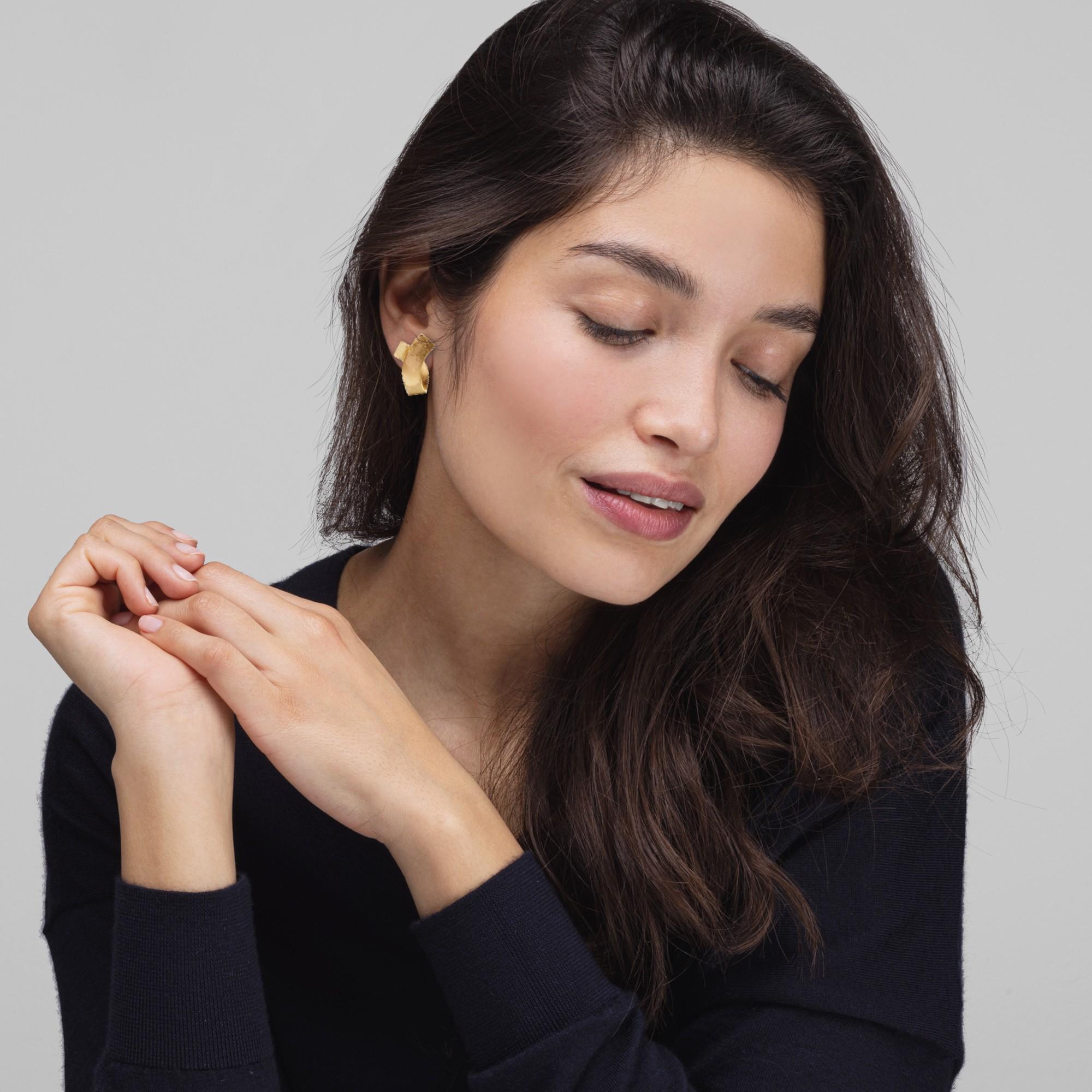 Alex Jona design collection, hand crafted in Italy, 18 karat rough frosted yellow gold stud earrings.
Dimensions: H 0.96in/24.51mm, W 0.70in/18mm, D 0.19in/5mm.

Alex Jona jewels stand out, not only for their special design and for the excellent