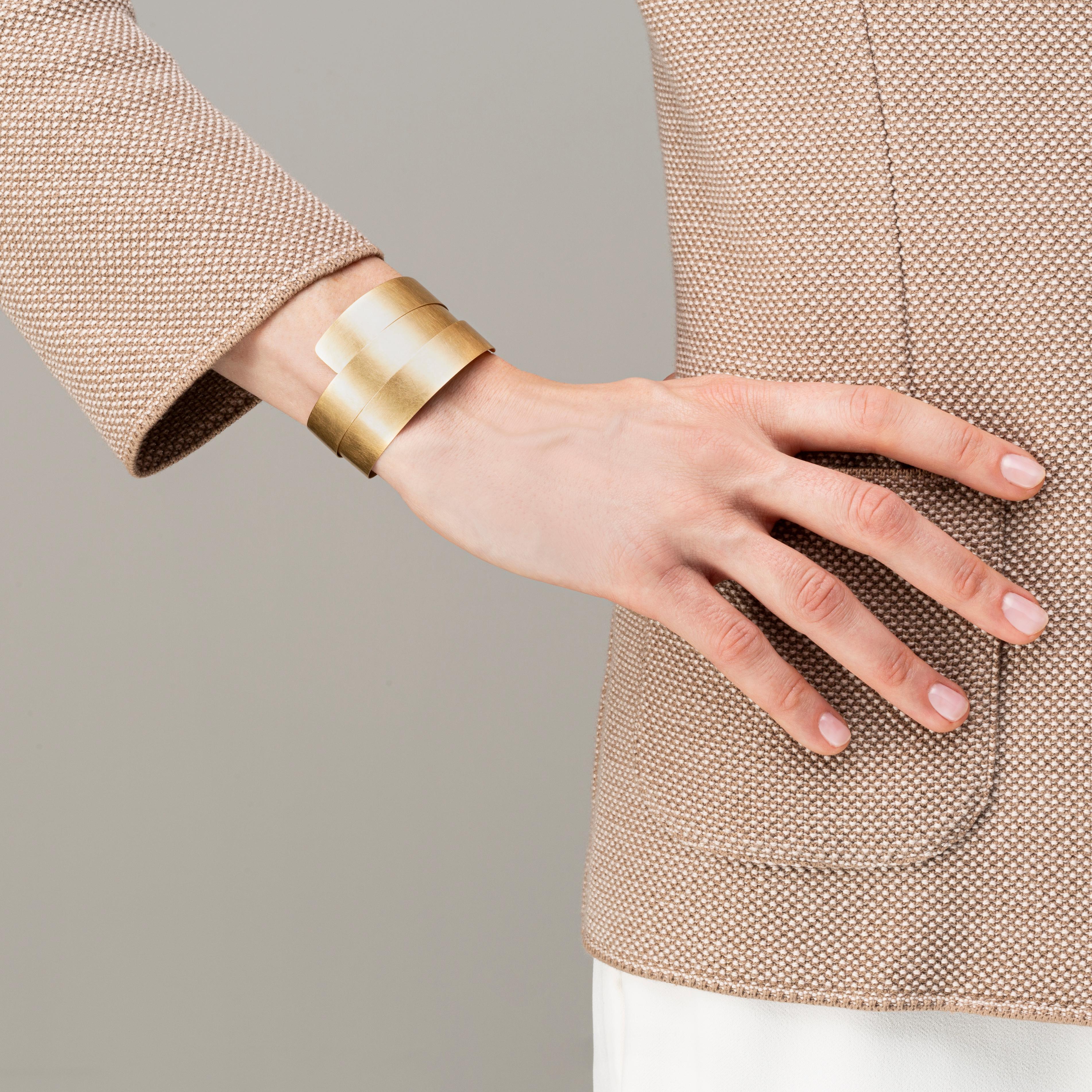 Alex Jona design collection, hand crafted in Italy, 18 karat brushed yellow gold cuff bracelet that wraps around the wrist. Dimensions: Width 11.95 mm, 51.08 mm Diameter,  Depth 0.66 mm.

Alex Jona jewels stand out, not only for their special design