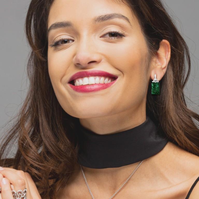 Alex Jona design collection, hand crafted in Italy, pair of 18 karat yellow gold dangle pendant earrings featuring two carved Burmese green jade weighing 7.61 carat and 48 diamonds weighing 0.25 carats. 
Dimension : H 1.17 in. x W 0.46 in - H 29.79