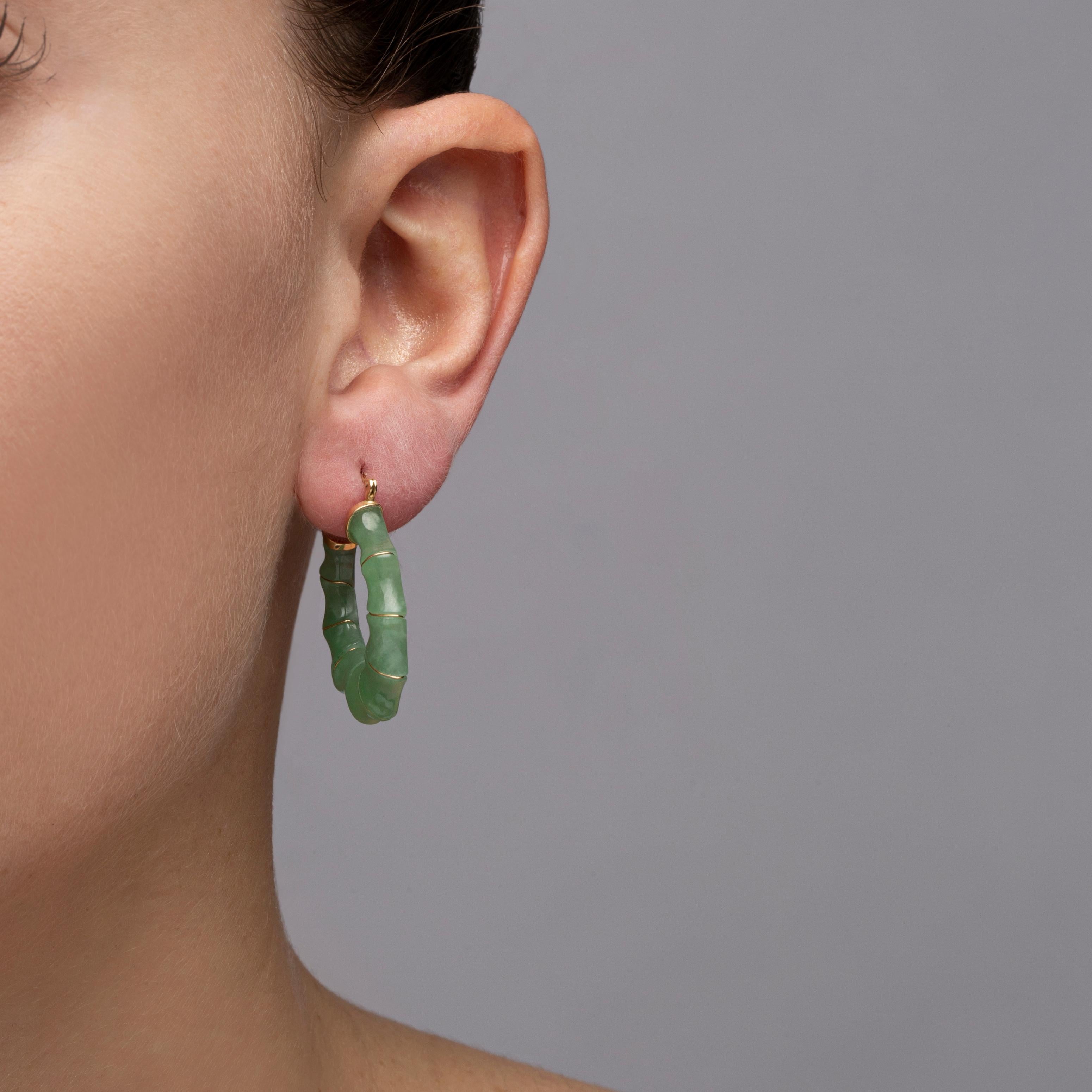 Alex Jona design collection, hand crafted in Italy, 14 karat yellow gold carved Burmese jadeite jade bamboo hoop earrings.  
Dimensions : H 1.28, D 1.12, W 0.20 in. -  H 32.65, D 28.22, W 4.85
Alex Jona jewels stand out, not only for their special