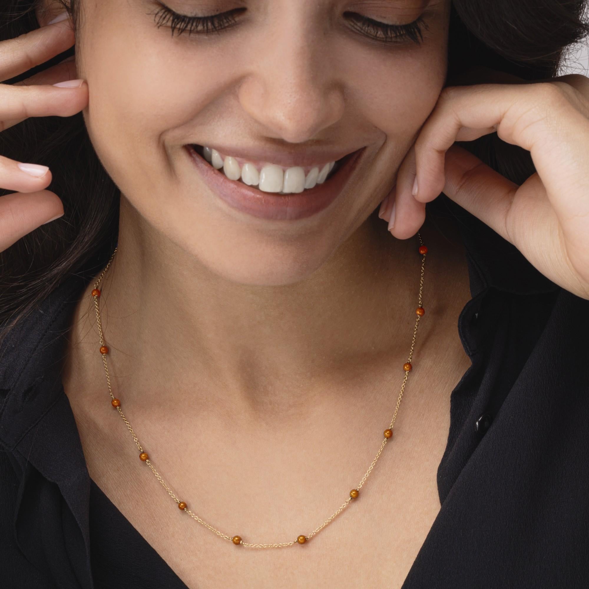 Alex Jona design collection, hand crafted in Italy, 18 karat yellow gold chain necklace alternating mediterranean coral beads. 
Alex Jona jewels stand out, not only for their special design and for the excellent quality of the gemstones, but also