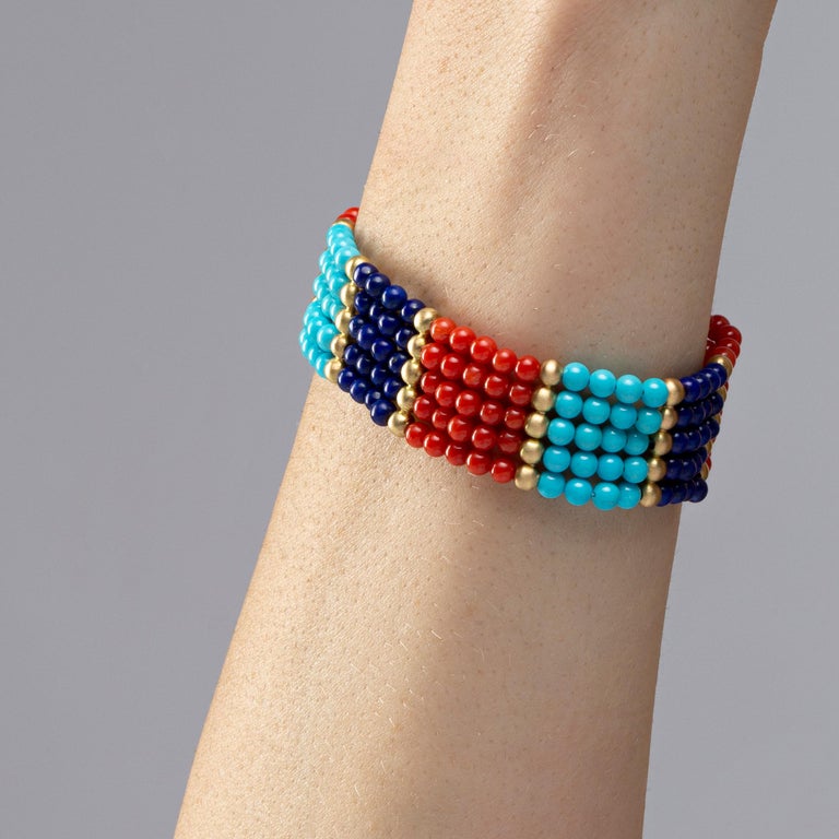 Alex Jona design collection, hand crafted in Italy, Coral Turquoise Lapis Lazuli cuff bracelet with a 18 karat brushed yellow gold clasp. 
Dimensions: L 17 cm / 6.69 in - H 2 cm / 0.78 in

Alex Jona jewels stand out, not only for their special