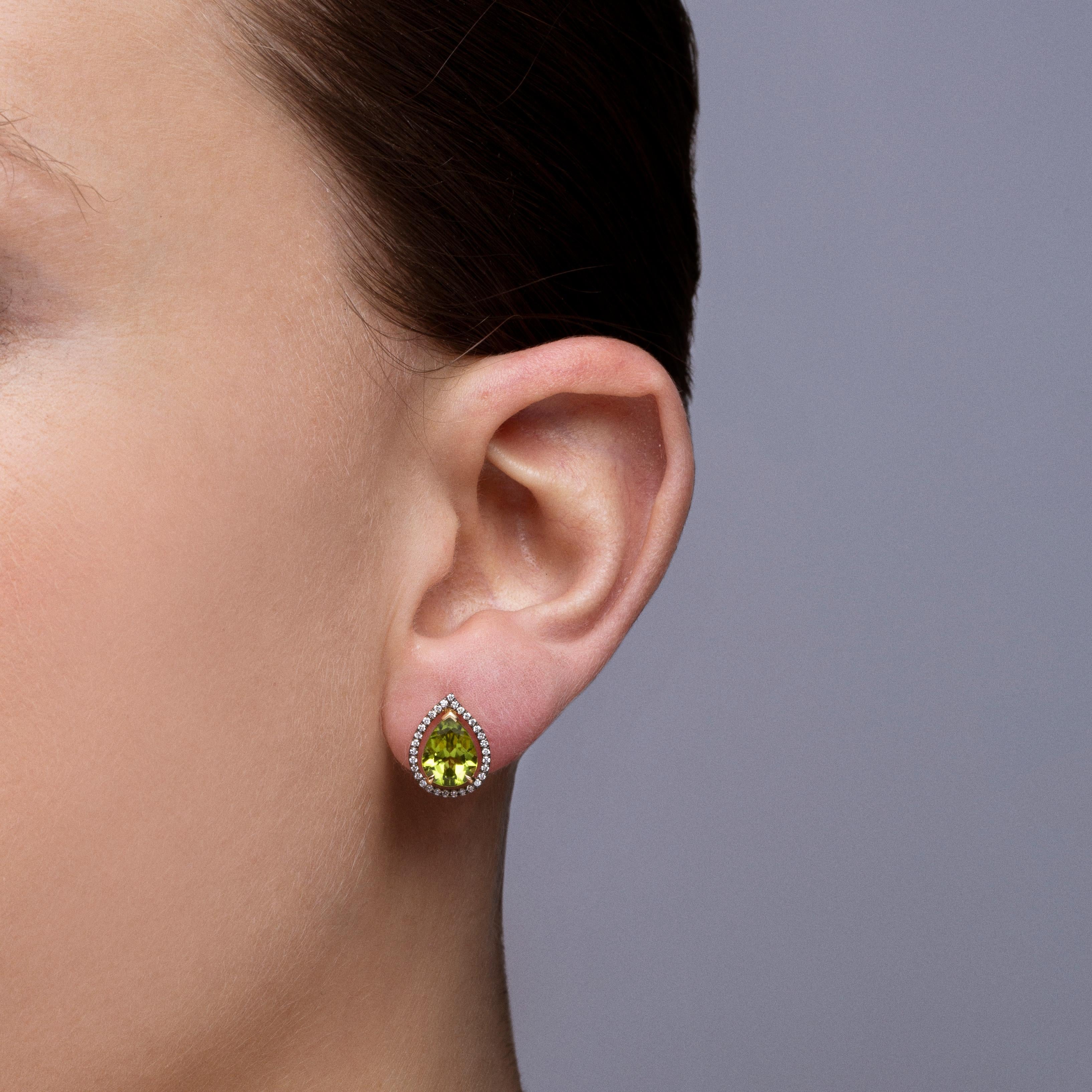 Alex Jona design collection, hand crafted in Italy, 18 karat yellow gold stud earrings set with two pear cut  peridots weighing 3.41 carats, surrounded by 0,22 carats of brilliant cut white diamonds, F color, VVS1 clarity.
Dimensions : H