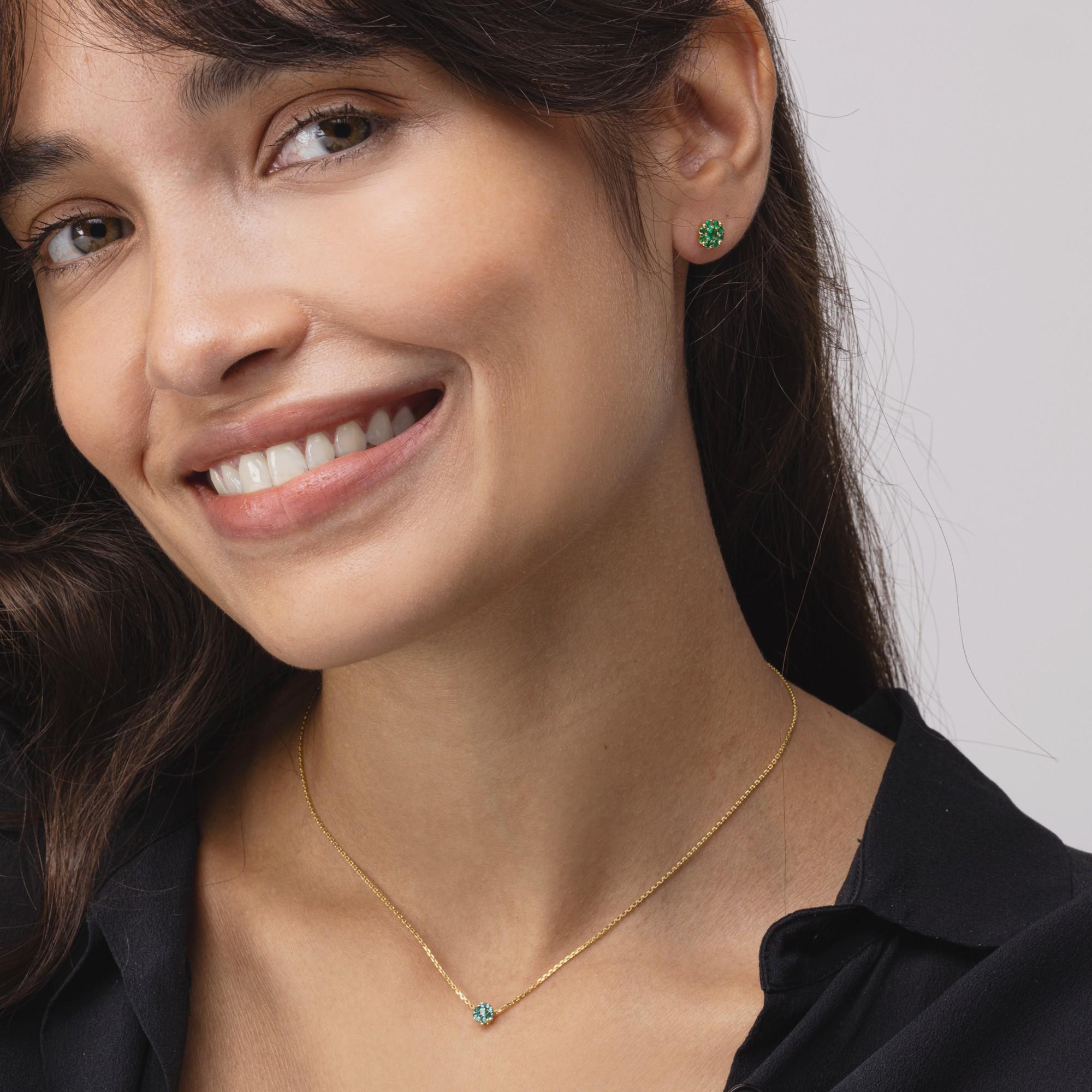 Alex Jona design collection, hand crafted in Italy, 18 Karat yellow gold chain necklace suspending a round pendant  set with 0.13 carats of round cut emeralds.

Alex Jona jewels stand out, not only for their special design and for the excellent