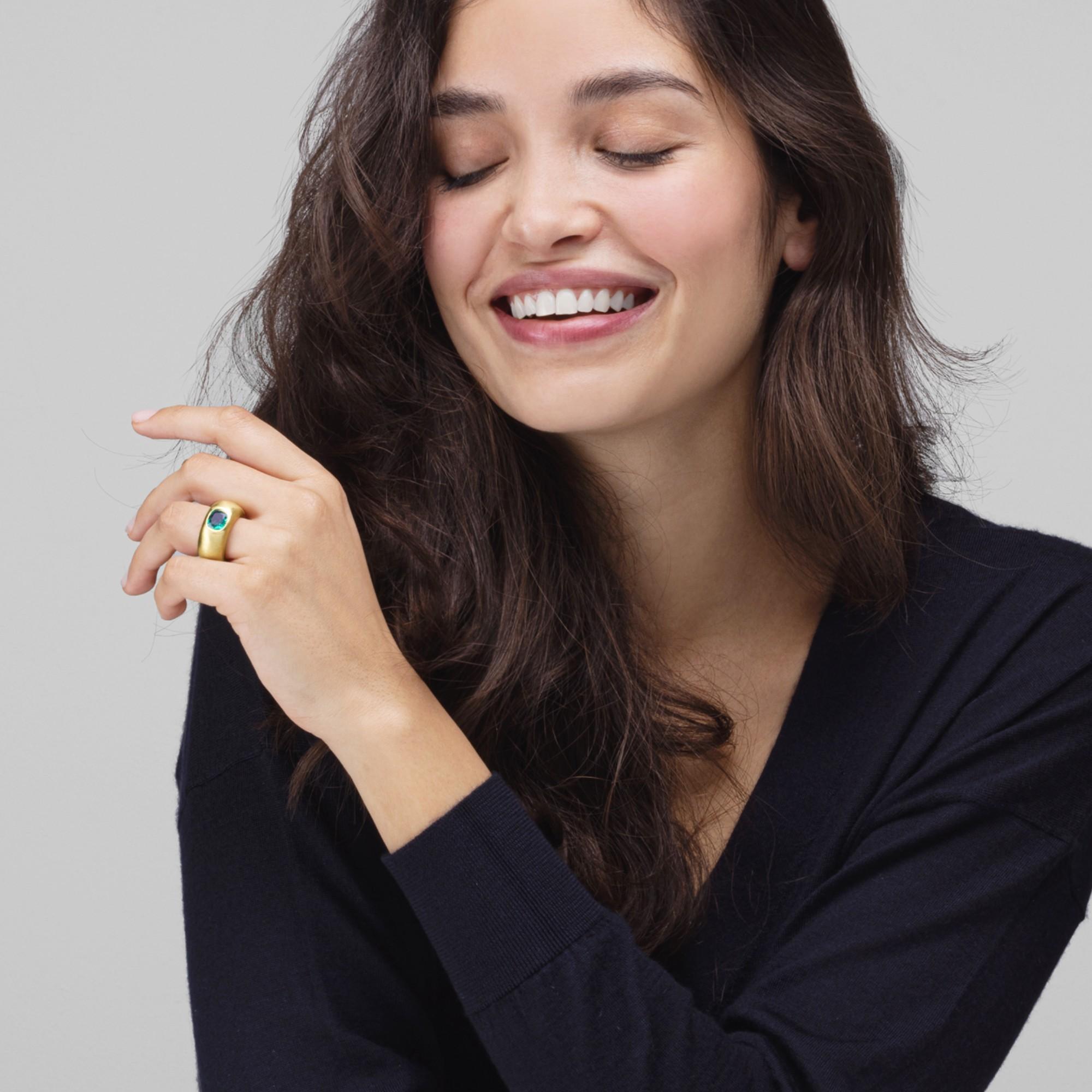 Alex Jona design collection, hand crafted in Italy, 18 carats yellow gold brushed band ring centering a cushion cut Emerald weighing 1.68 carats.

Alex Jona jewels stand out, not only for their special design and for the excellent quality of the