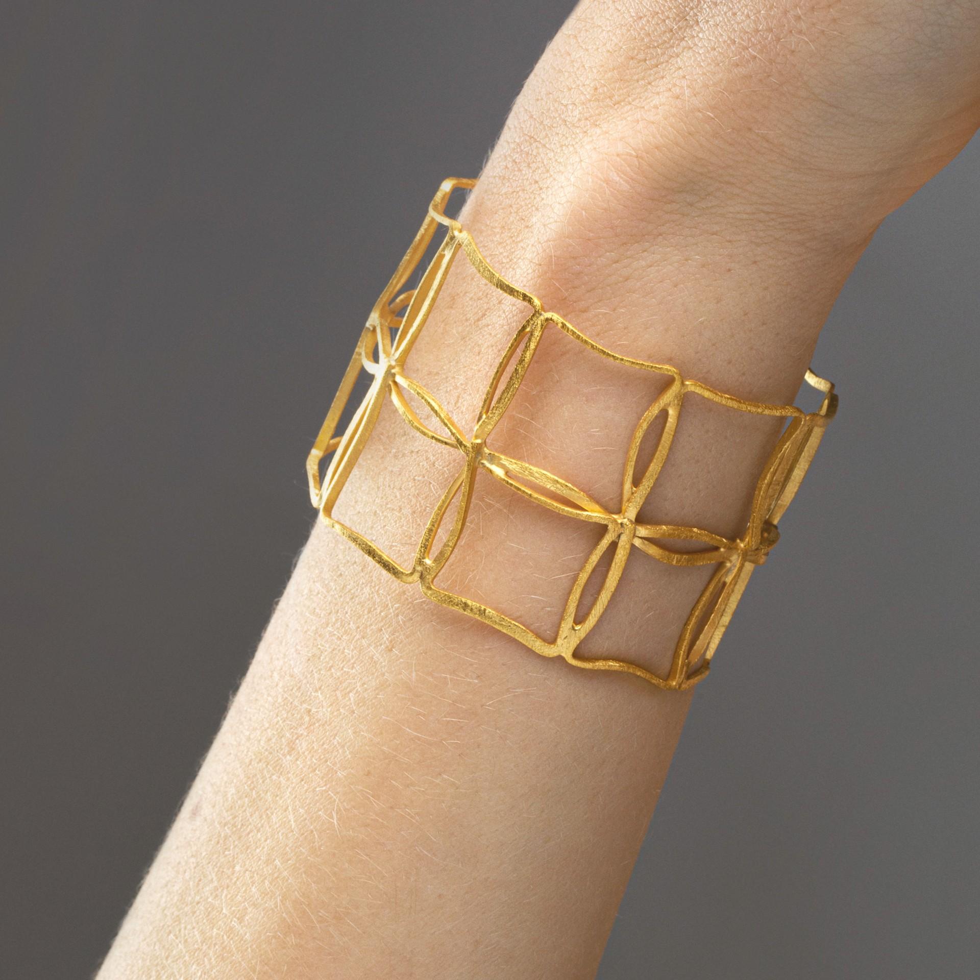 Alex Jona design collection, hand crafted in Italy, gold plated sterling silver cage bracelet with a brushed finish. 
Alex Jona jewels stand out for the careful attention given to details during all the manufacturing process. Alex's passion for