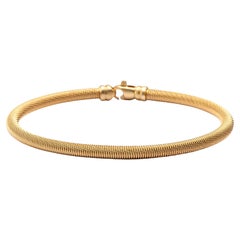 Pulsera brazalete de alambre trenzado de plata de ley chapada en oro Alex Jona