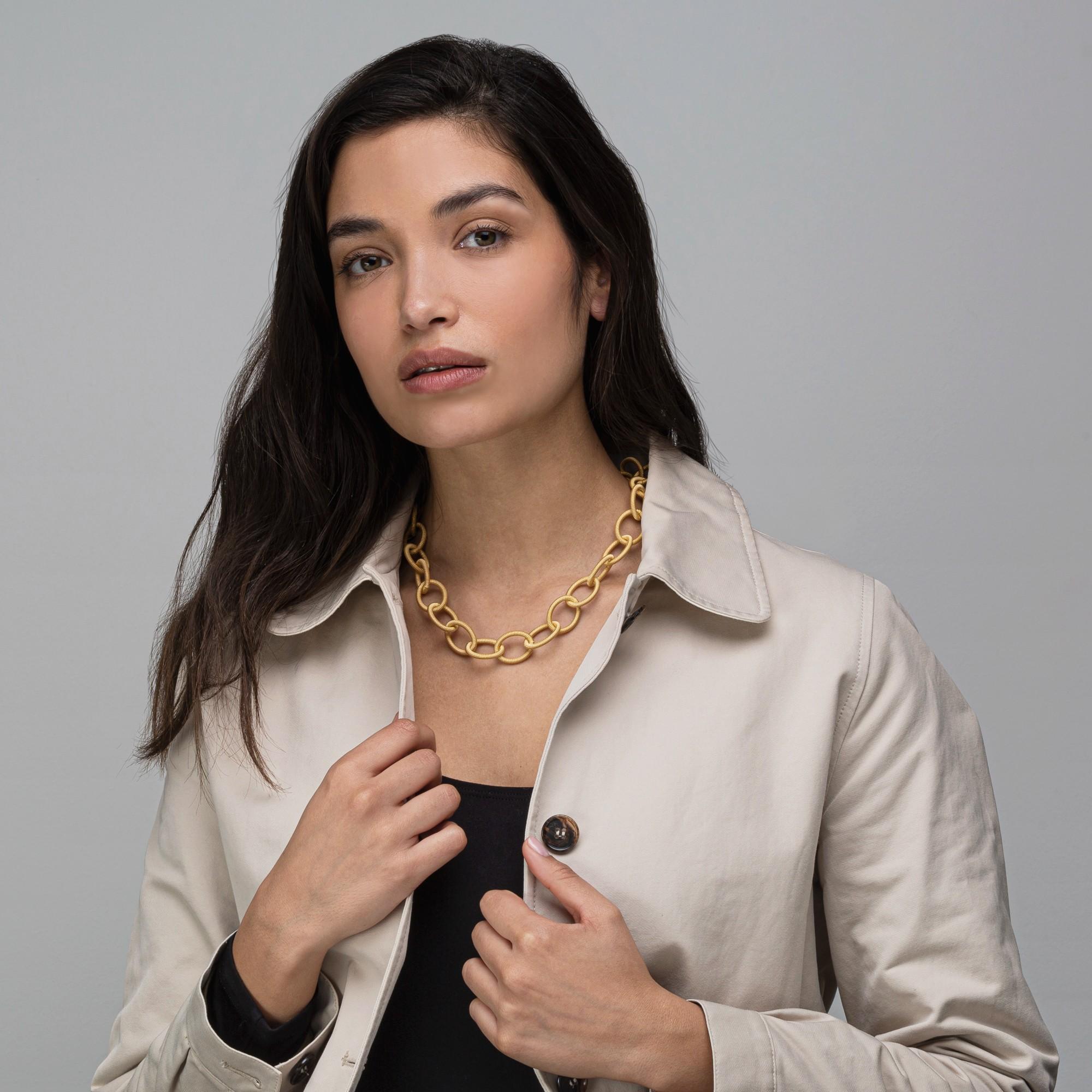 Alex Jona design collection, hand crafted in Italy, gold plated sterling silver twisted wire necklace. 

Alex Jona jewels stand out, not only for their special design and for the excellent quality of the gemstones, but also for the careful attention