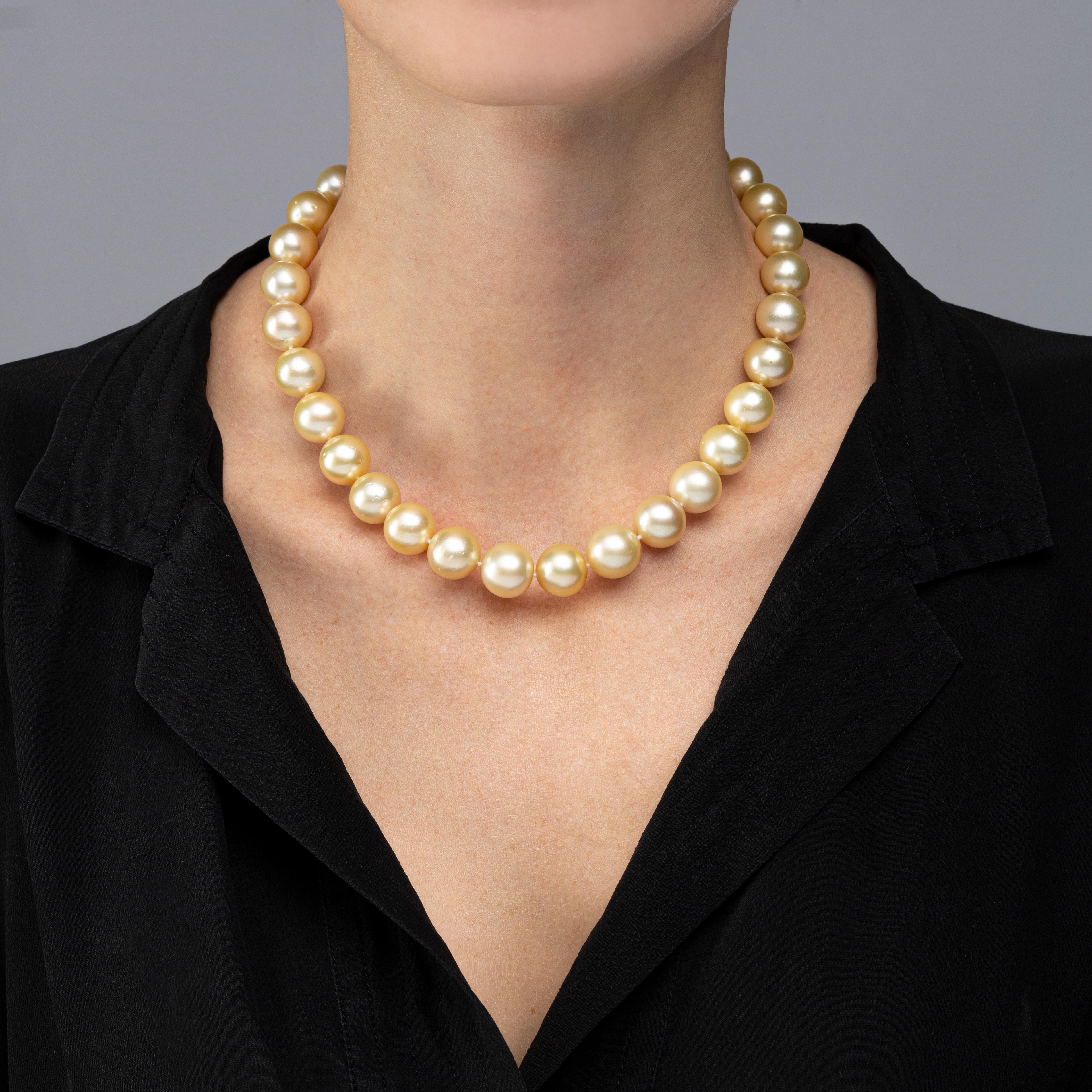 Alex Jona Golden South Sea pearl necklace, composed of 31 cultured pearls ranging from 10.7 to 13.7mm in diameter, total length: 17.5 inch/44.5 cm, strung on a hand-knotted silk cord and secured by a hand crafted three tone 18K gold clasp. 

Alex