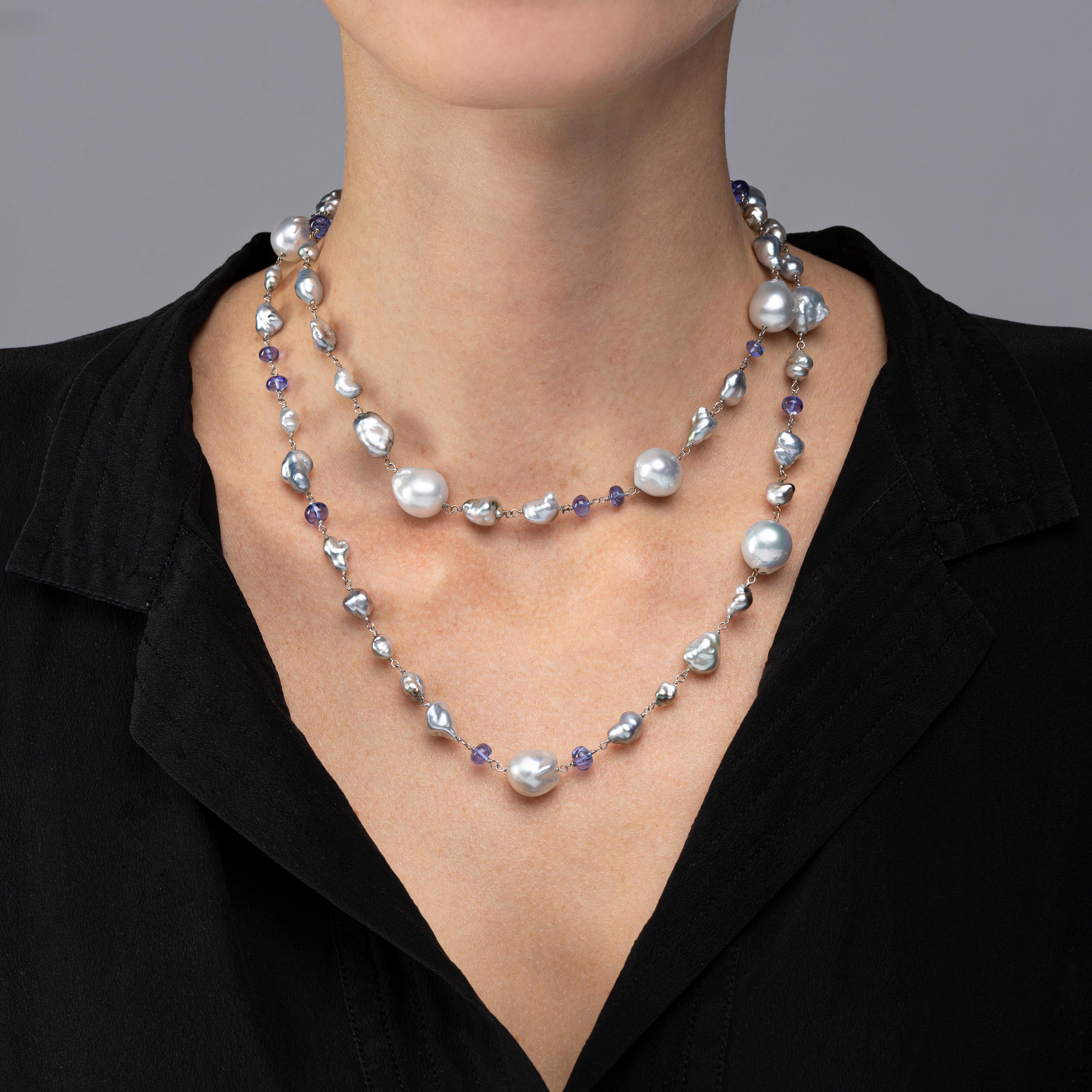 Alex Jona design collection, hand crafted in Italy, 18 karat white gold, 35.43 in / 90 cm long sautoir necklace featuring 40 keshi grey Tahiti pearls, 9 baroque Tahiti grey pearls, alternating with 15 cabochon tanzanites.

Alex Jona jewels stand