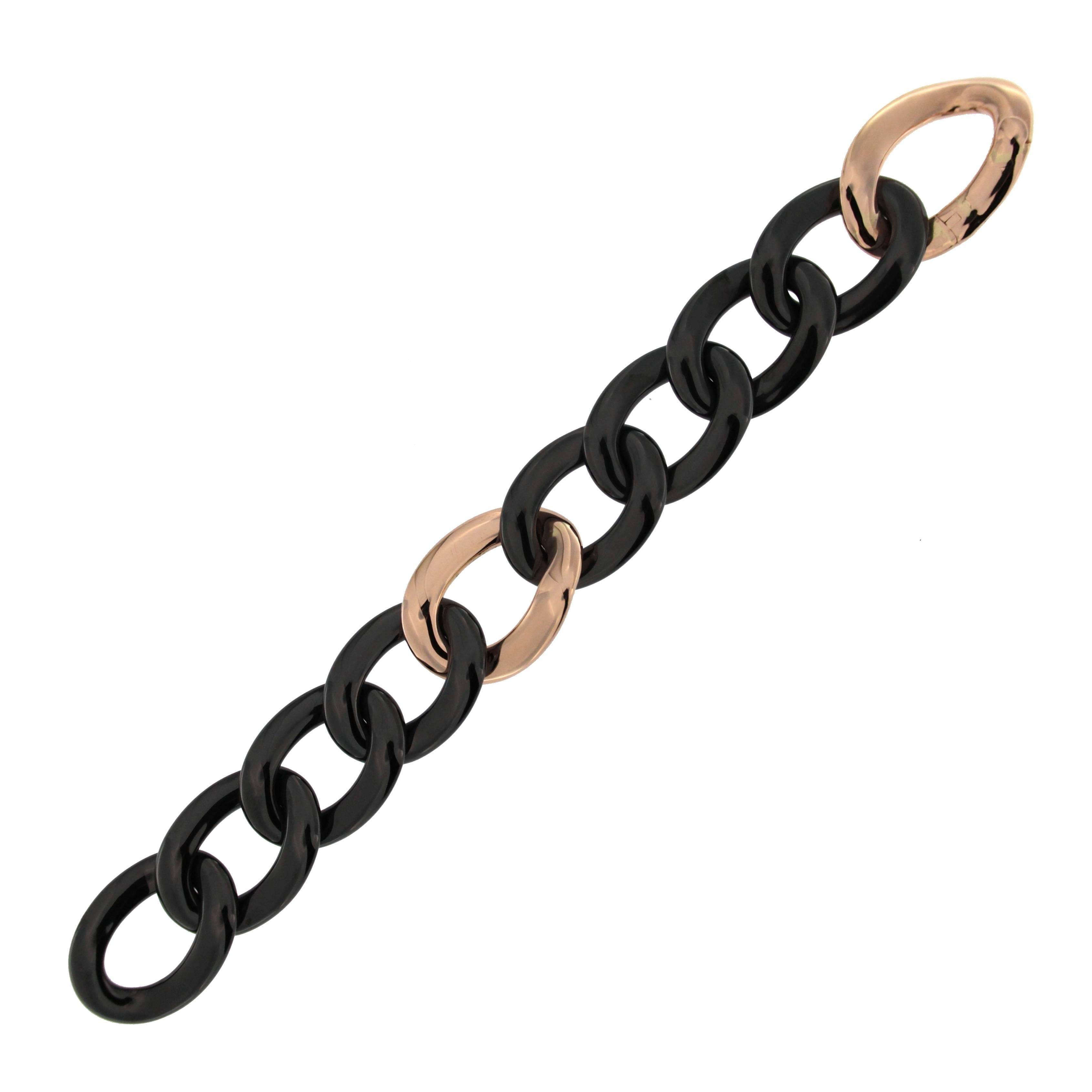 Alex Jona design collection, hand crafted 18k yellow gold and black high-tech
ceramic curb-link bracelet.
Dimensions :  L x 7.28 in, W x 2.5 in - L x 184.9 mm , W x 63.5 in.
With a hardness approaching that of diamond, high-tech ceramic is a