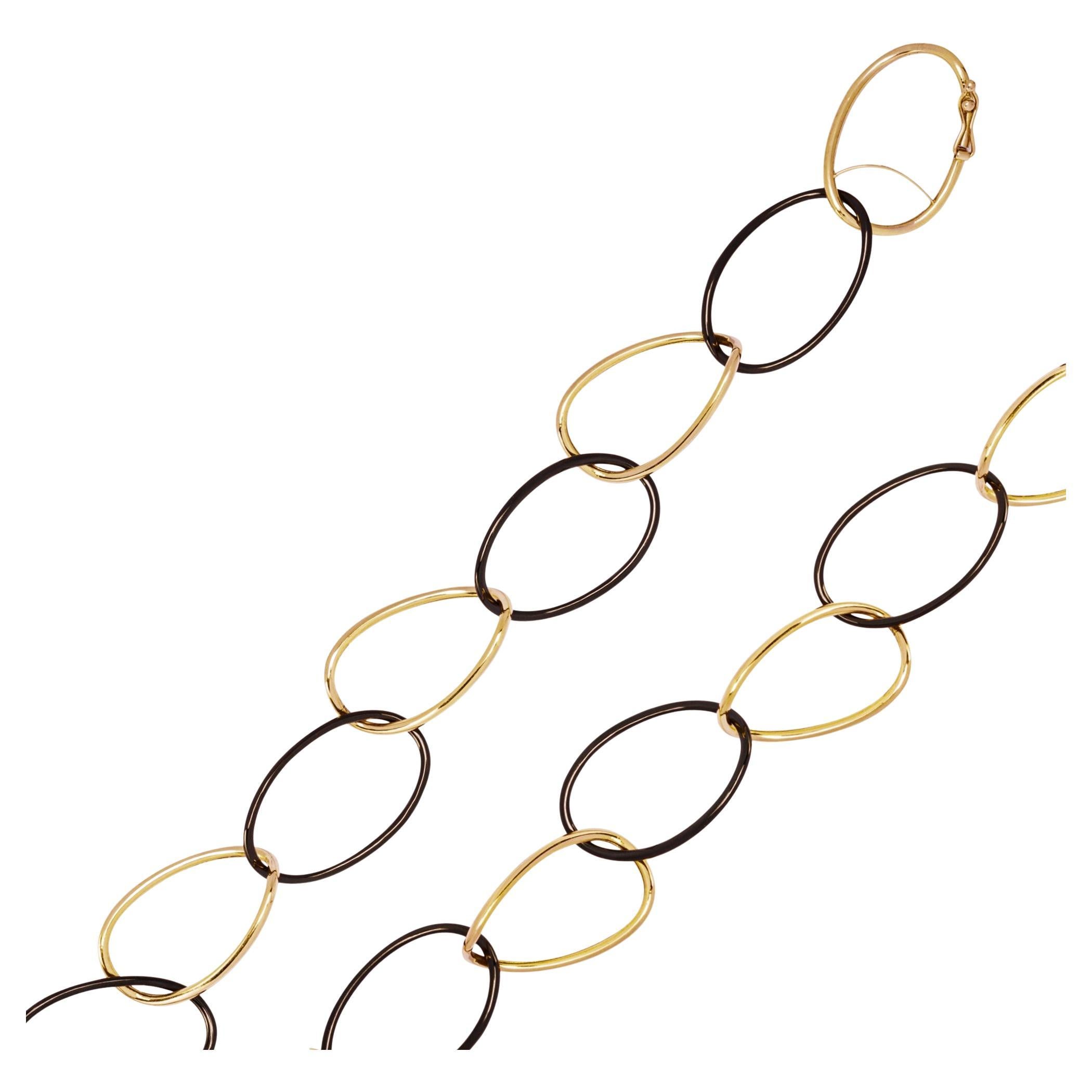 Alex Jona High-Tech Schwarze lange Halskette mit geschwungenen Gliedern aus Keramik in Gold im Angebot