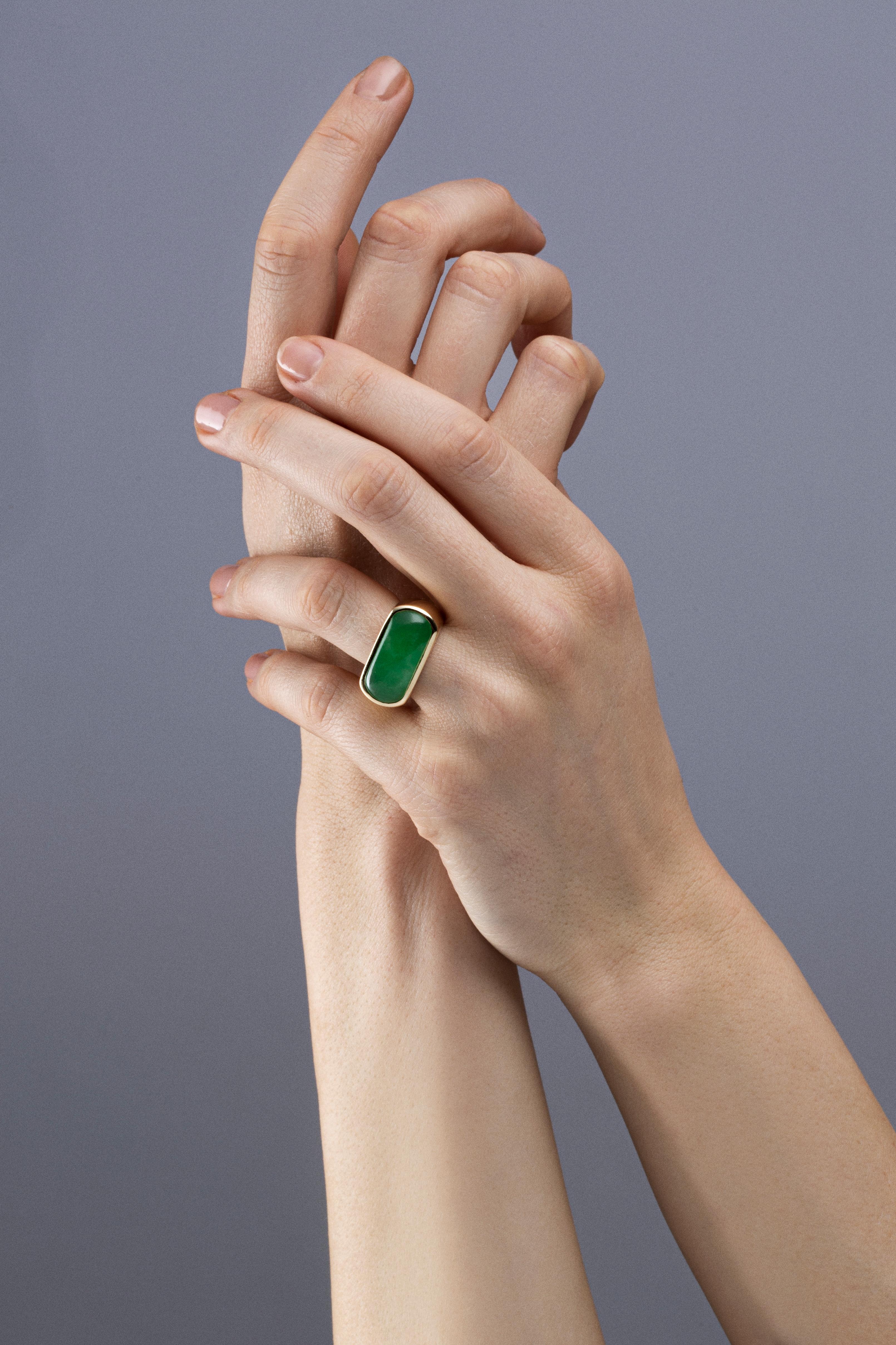 Alex Jona design collection, hand crafted in Italy, 18 karat yellow gold ring set with an oblong Burmese Jade weighing 8.86 carats. Ring size US 6.5- EU 12, can be sized to any specification. Ring Dimensions: H 0.95 in x W 0.95 in x Dm 0.63 in - H